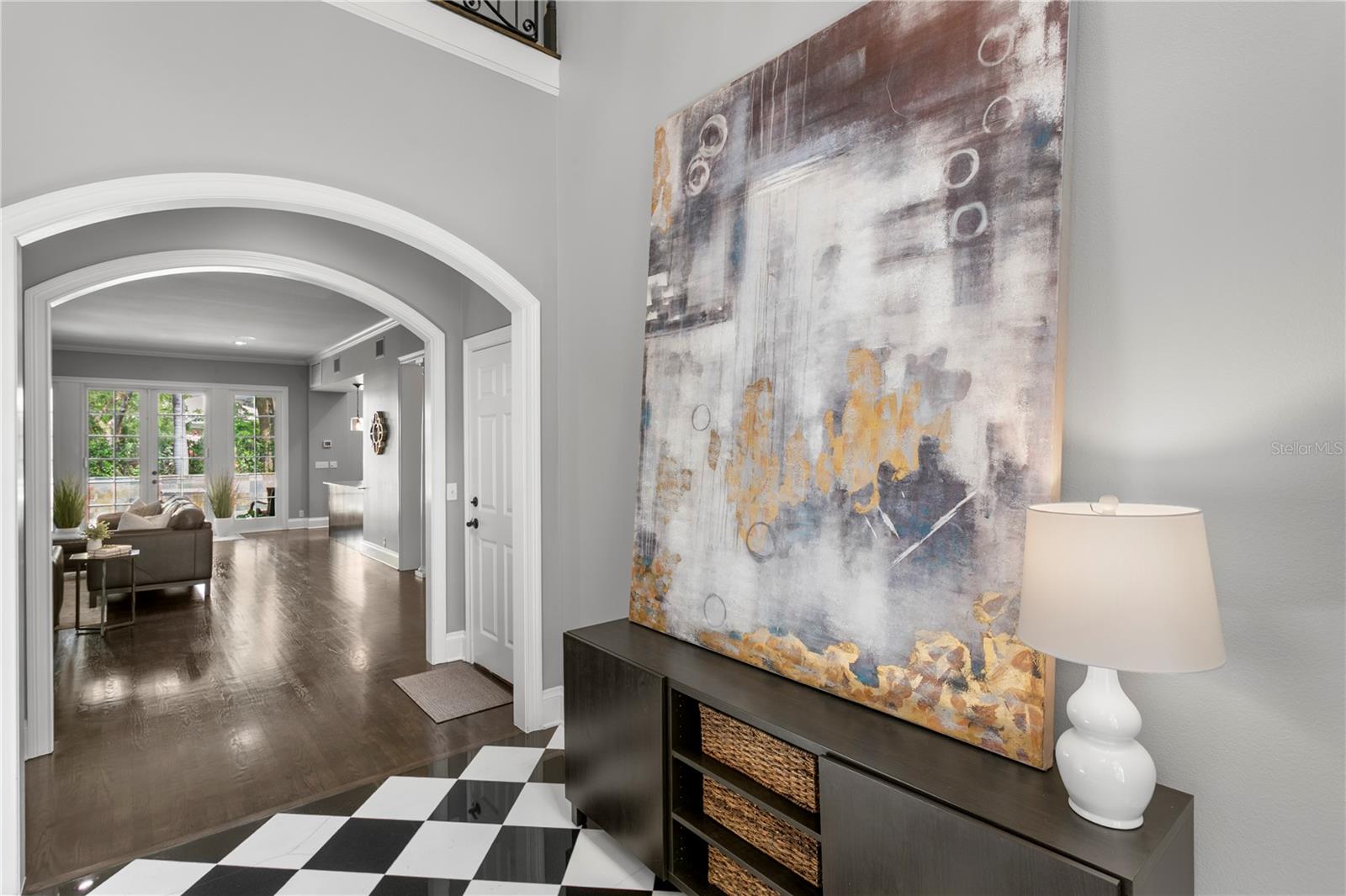 A stunning marble foyer, dramatic cathedral-height ceilings, and superior craftsmanship welcome you home.