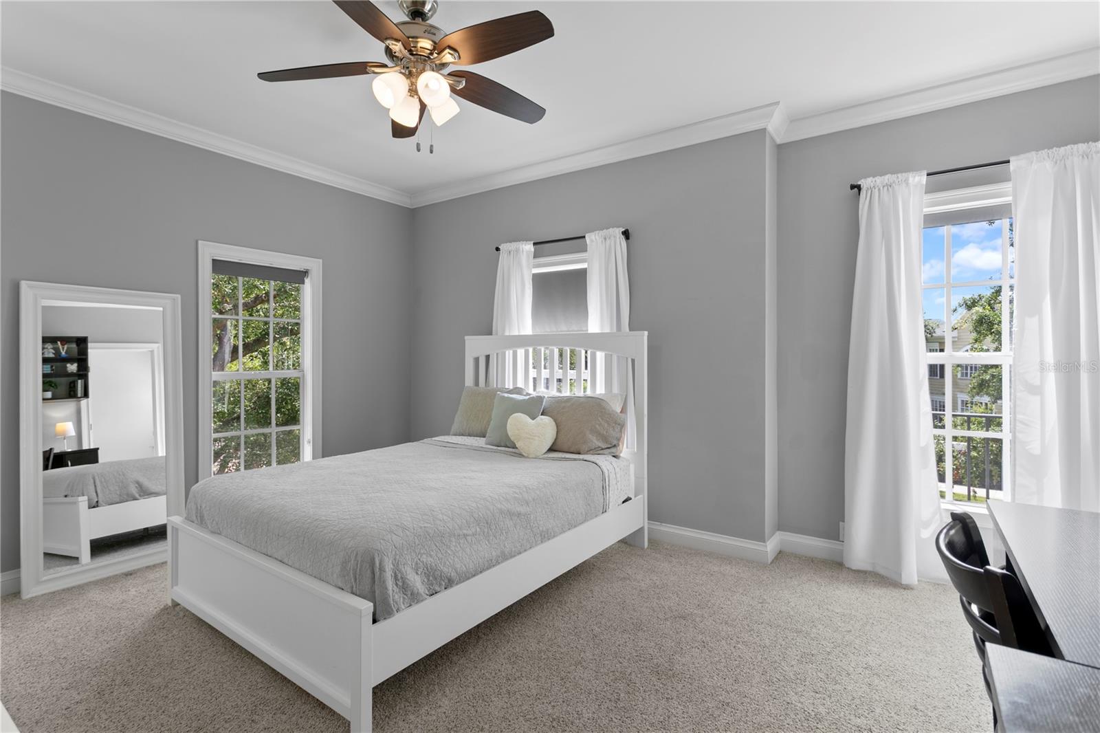 Nicely sized secondary bedroom offers plenty of space for a bed and a dedicated desk area and has an ensuite bathroom