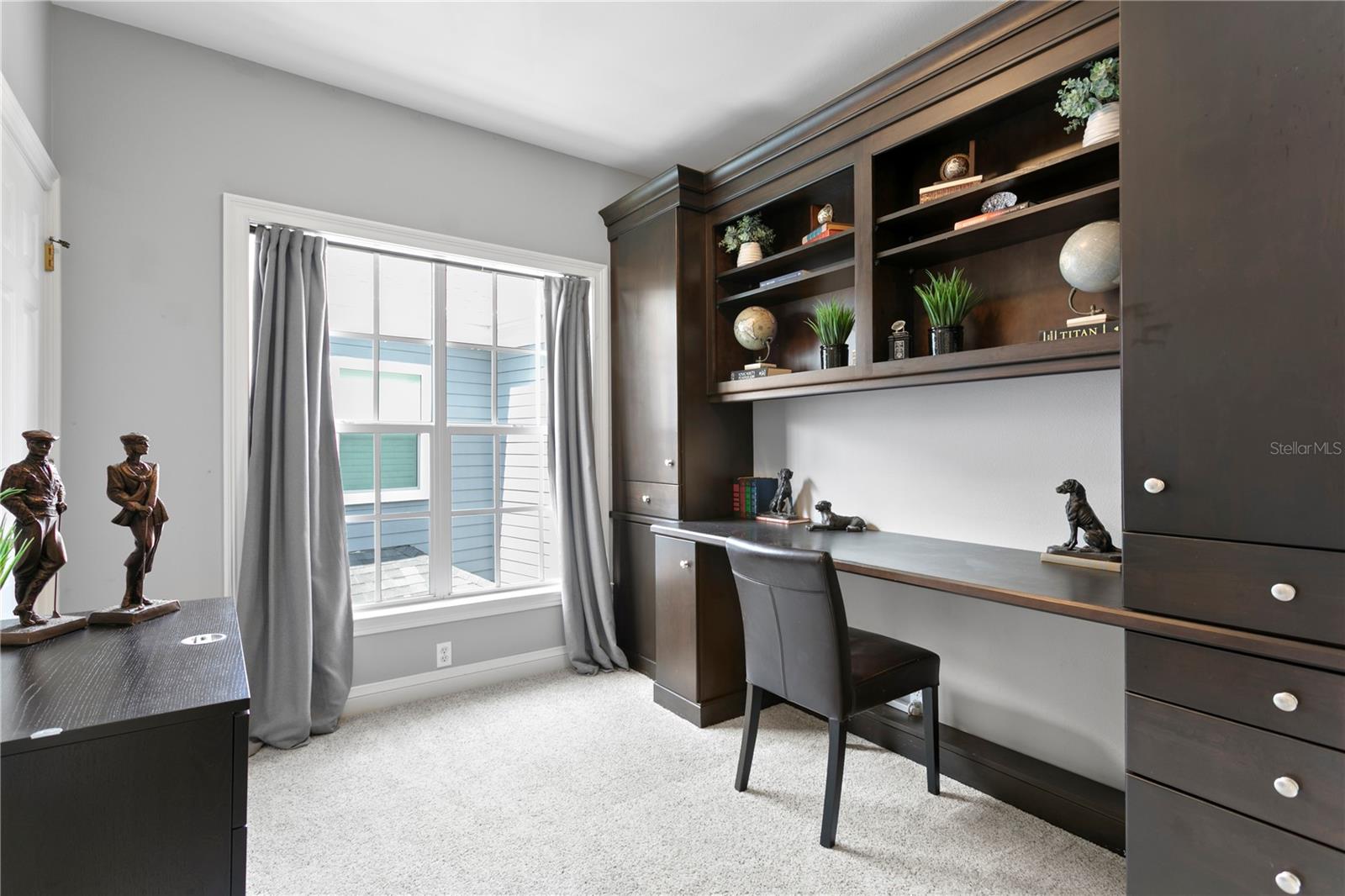 Currently utilized as a home office, the fourth bedroom provides a quiet and flexible workspace.