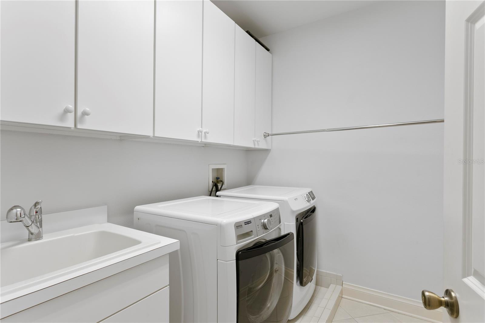 Conveniently located upstairs, the laundry room makes managing dirty clothes quick and easy