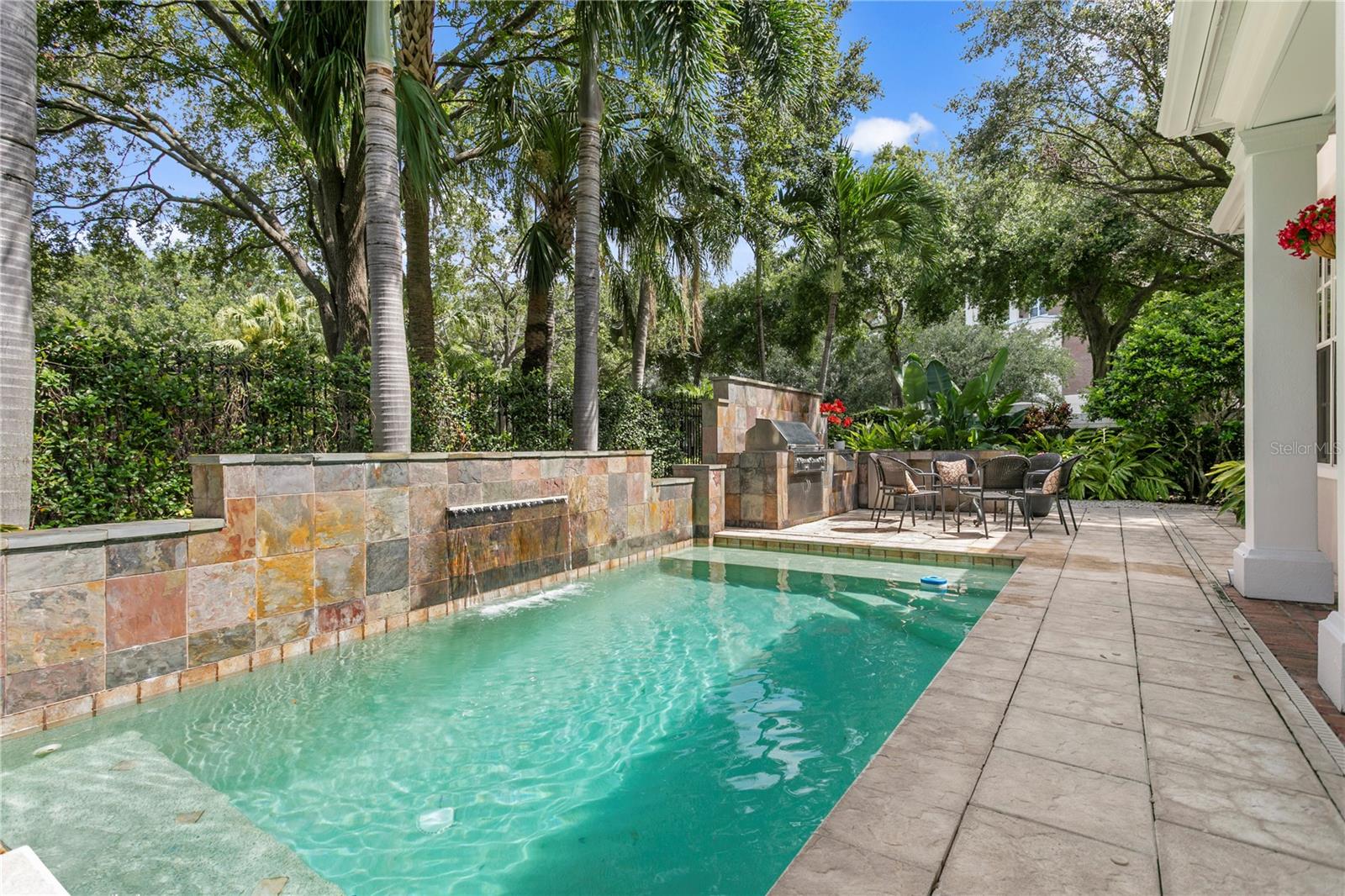 This stunning pool provides a refreshing centerpiece for outdoor living and fun-filled gatherings.