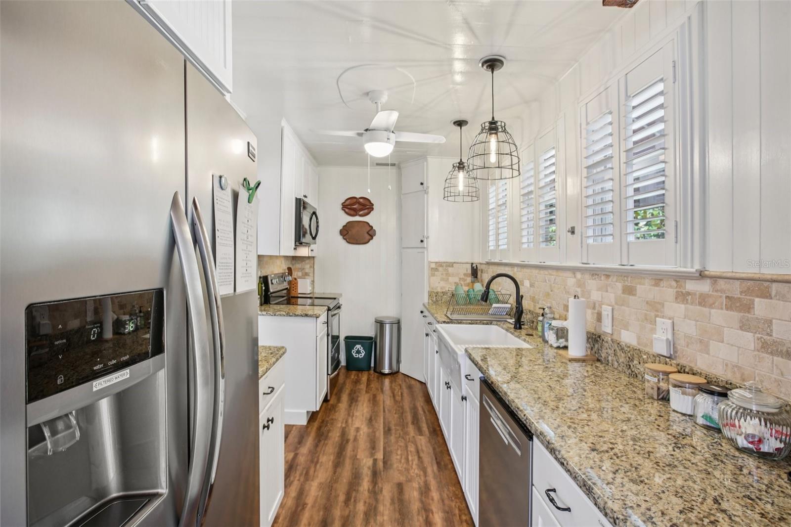 Main House with fridge kitchen from entry of back door through laundry room