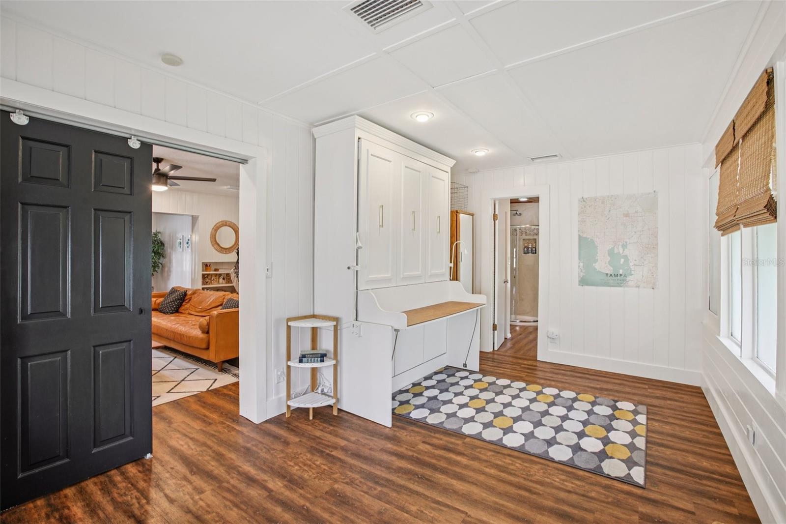 Murphy bed closed in potential 3rd bedroom wide angle