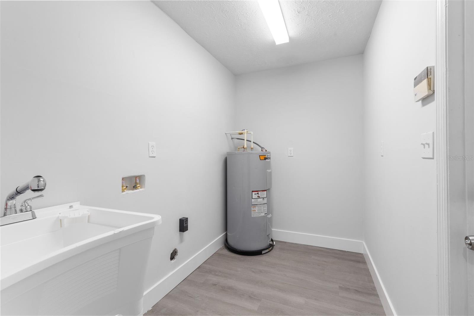 Laundry Room With Utility Sink