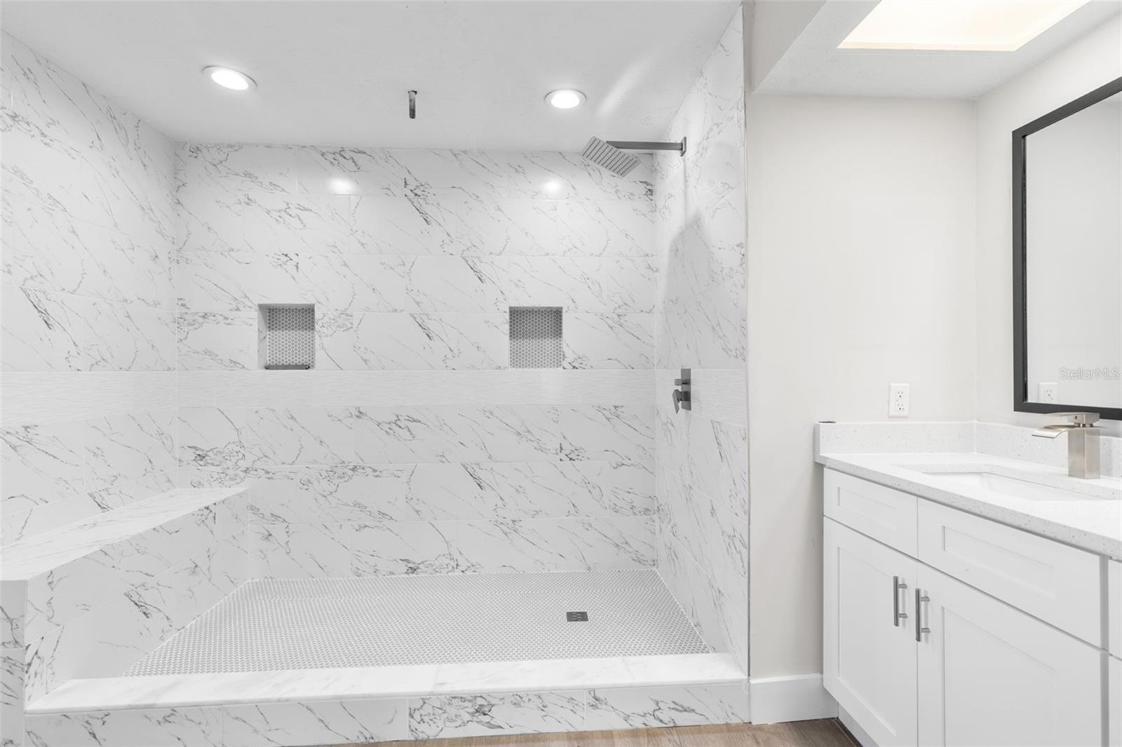 Tiled Walk-In Shower With Recessed Lighting/Shower Bench