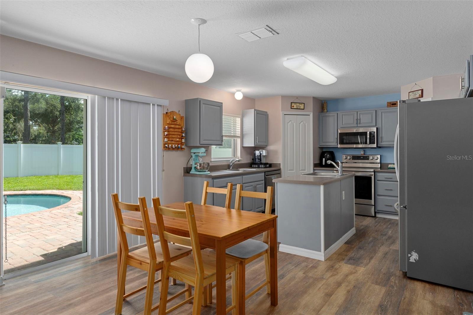 Lovely Dining Area, notice the sliding glass doors out to the pool area