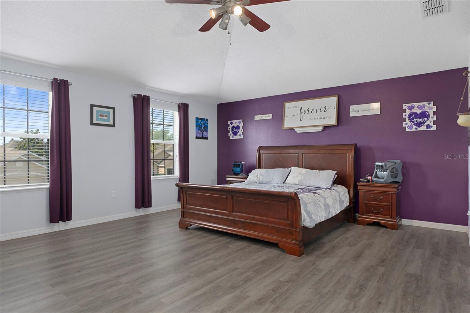 The Master Bedroom has beautiful wood floors and is a bright and open space