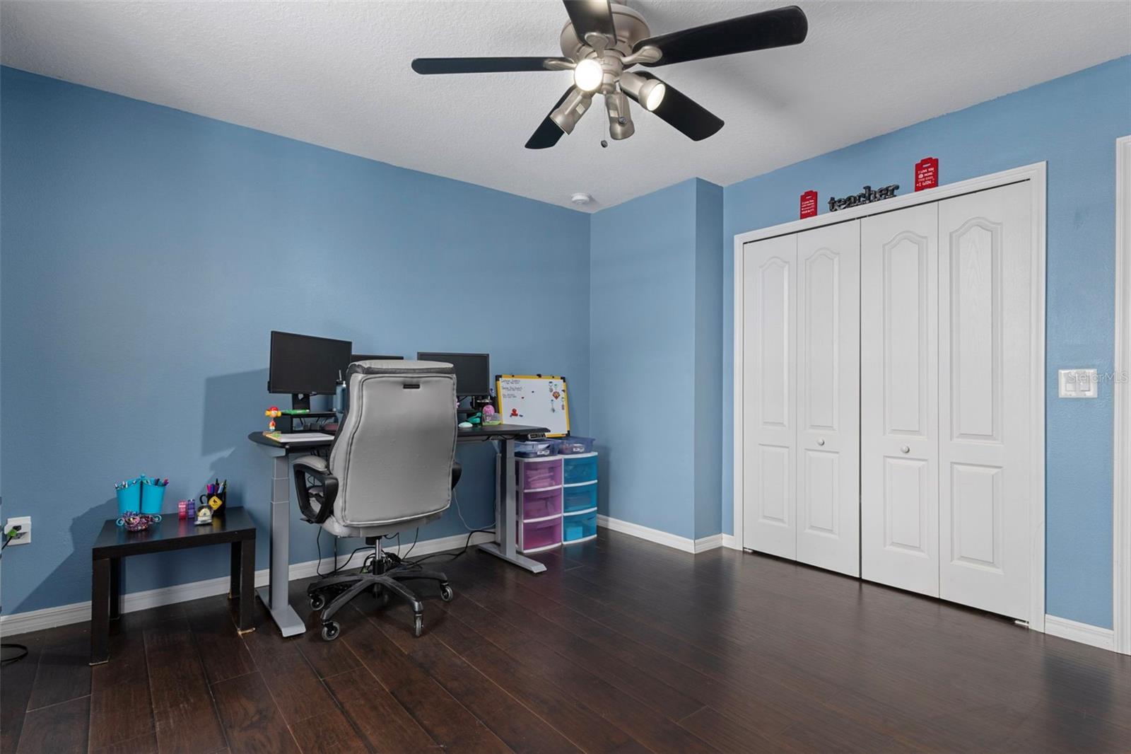 Notice the large closet and fan/light in this bedroom