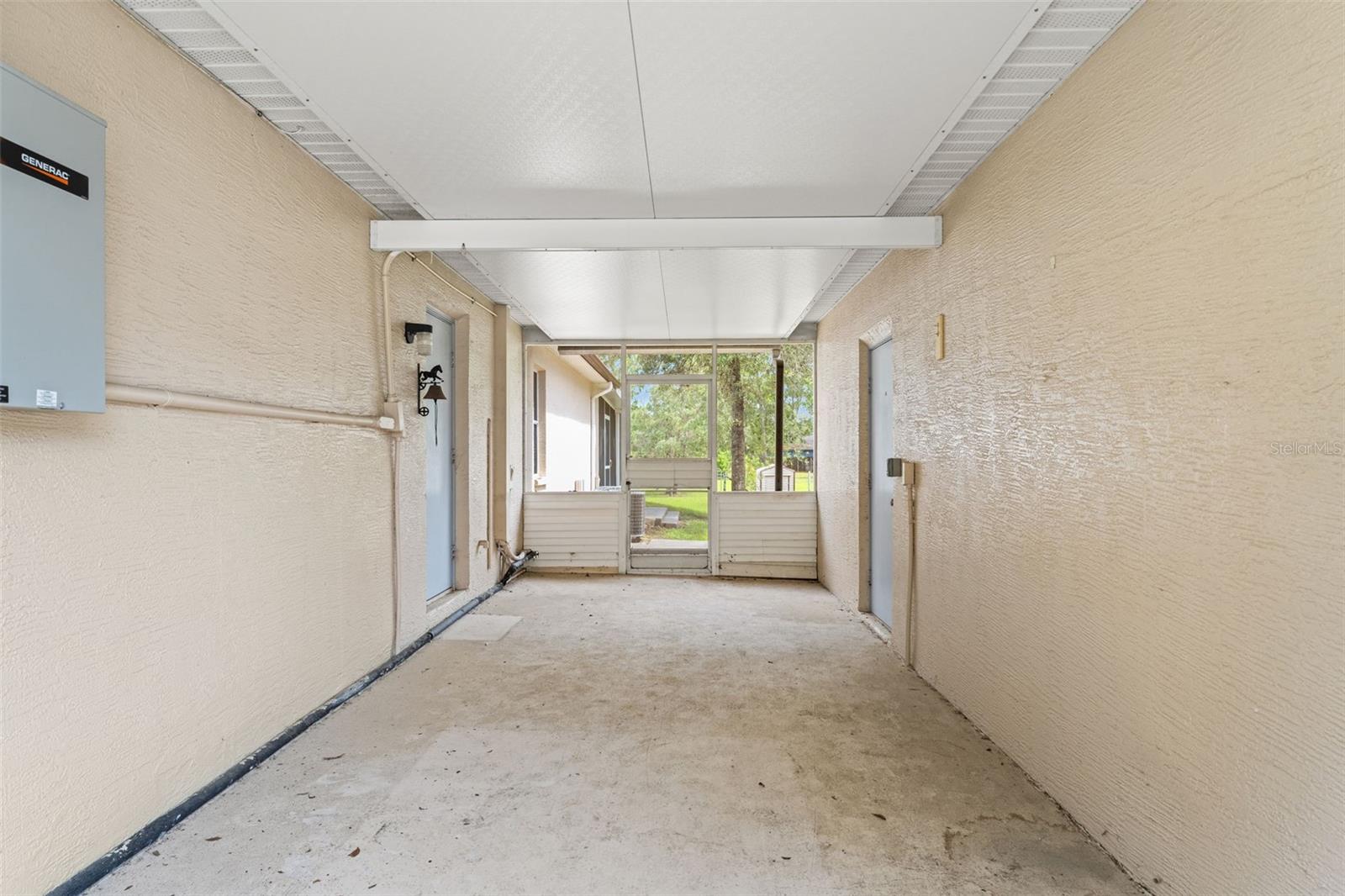 breezeway between house and 3 vehicle garage