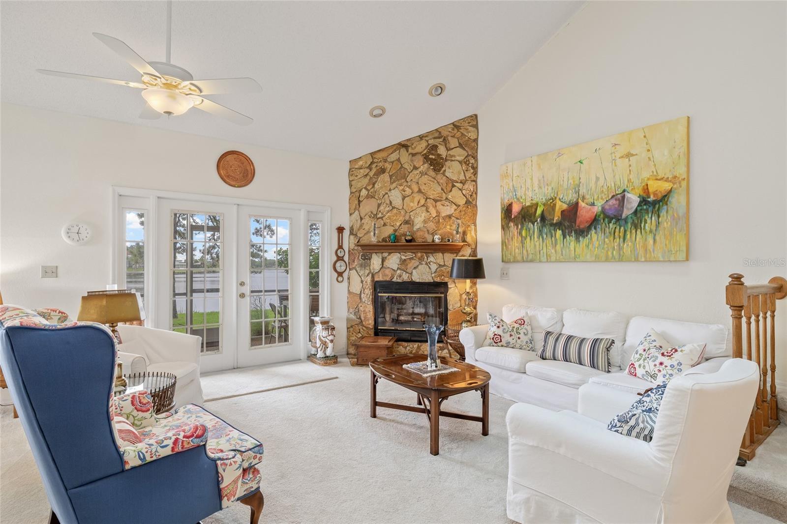 Light and bright with additional windows given the end unit and a stoic wood-burning fireplace.