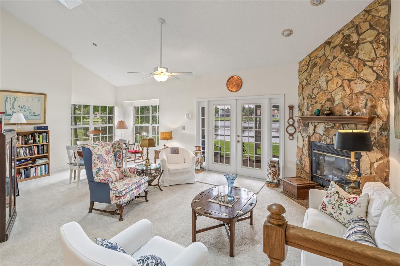 Beautiful open concept with French doors leading to the porch.