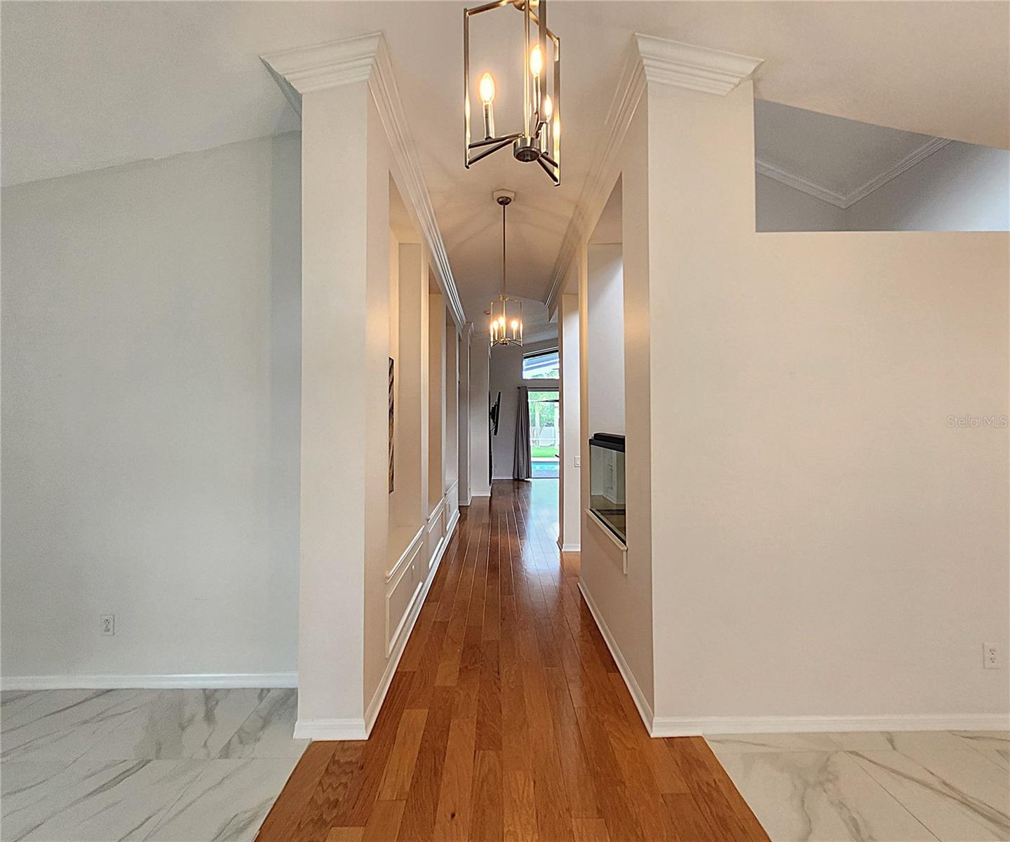 Wall Moldind in Hallway. Flooring: Genuine Hardwood & Large Ceramic Tiles