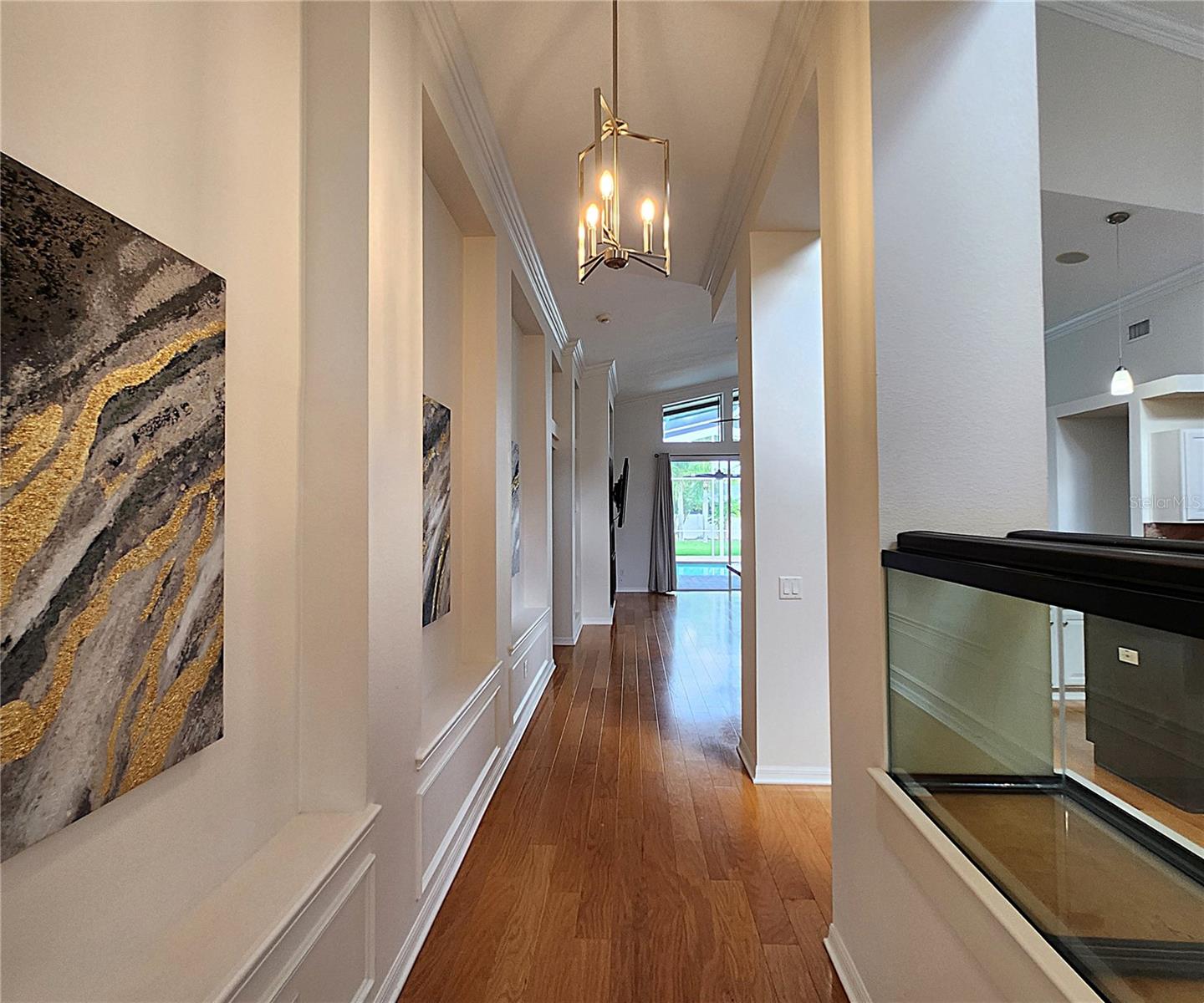 Wall Moldind in Hallway. Flooring: Genuine Hardwood & Large Ceramic Tiles