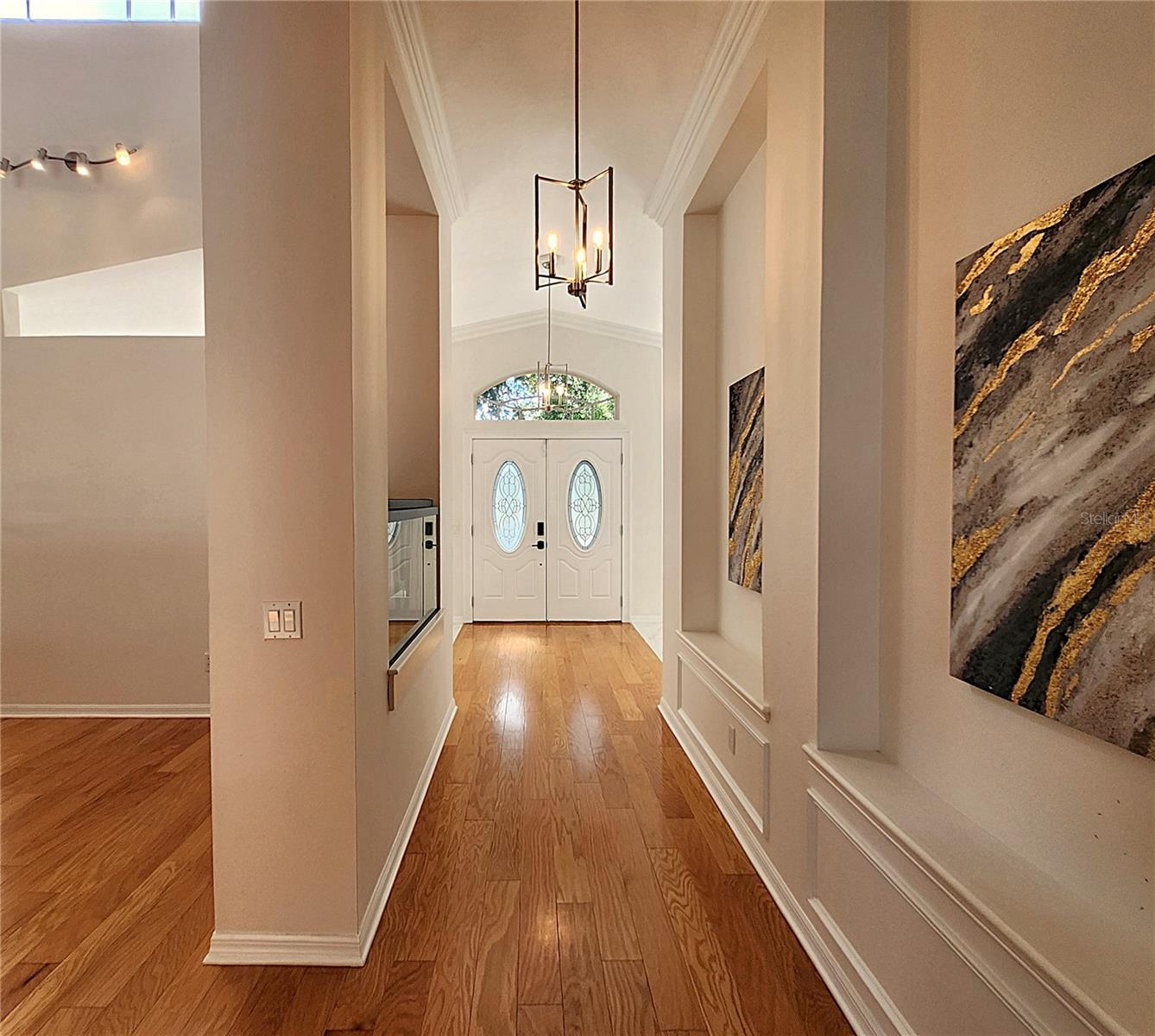 Wall Moldind in Hallway. Flooring: Genuine Hardwood & Large Ceramic Tiles