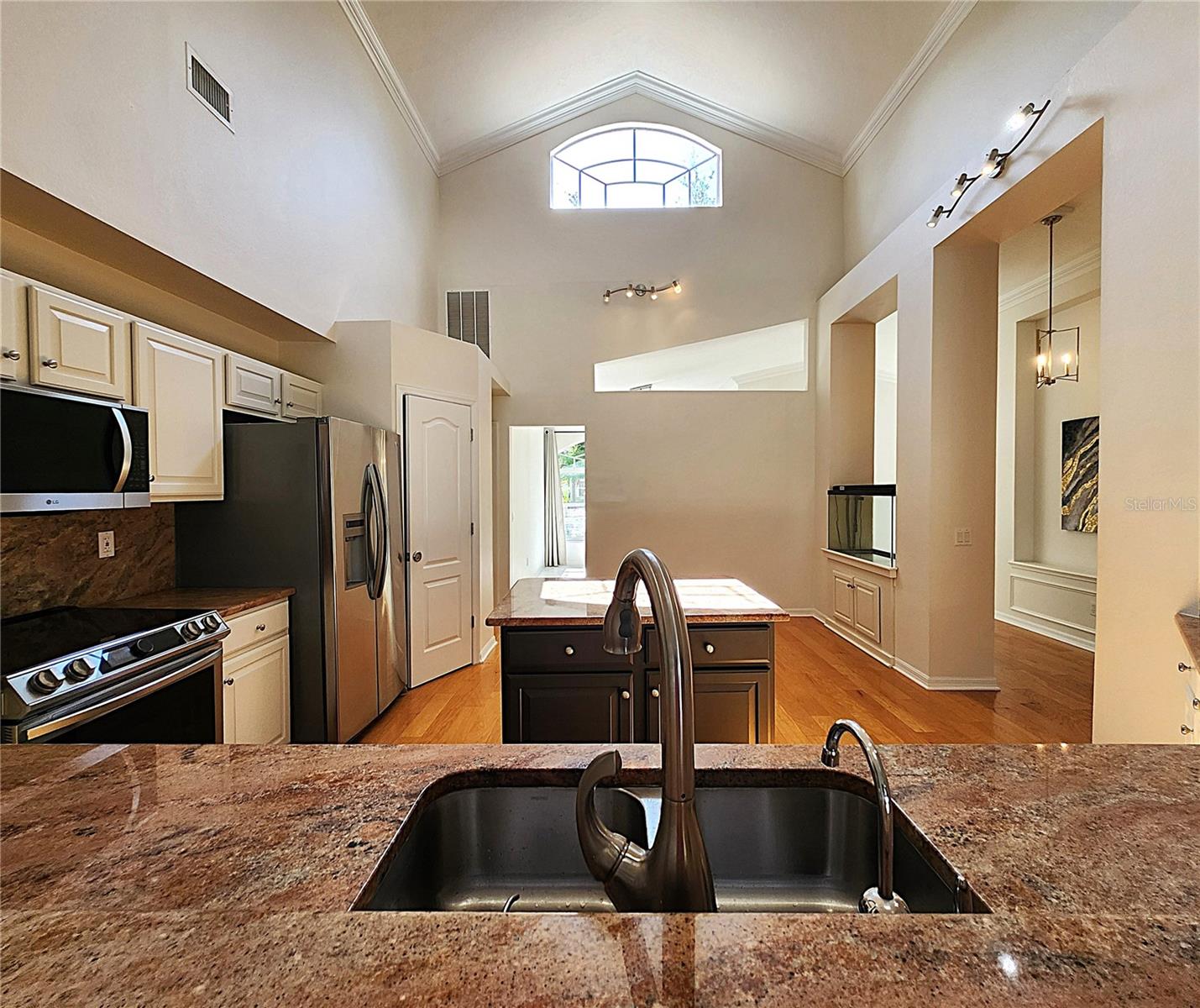 All appliances included: electric garbage disposal, dishwasher, mounted microwave, fridge, convection oven