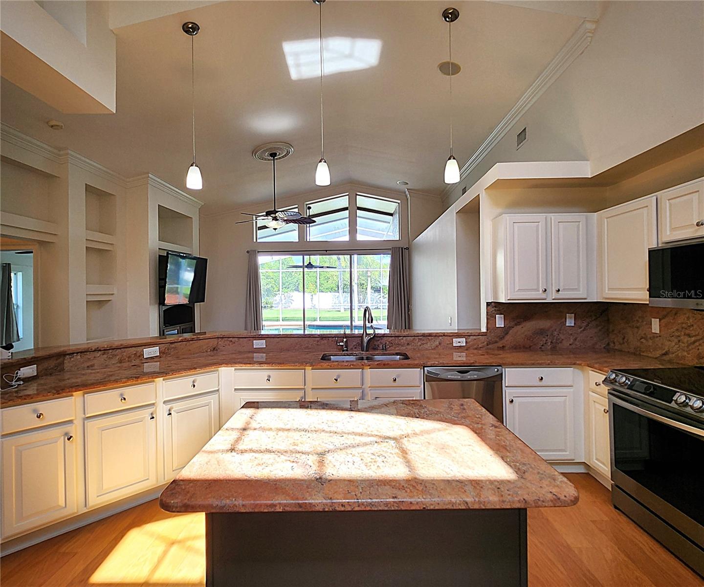 All appliances included: electric garbage disposal, dishwasher, mounted microwave, fridge, convection oven