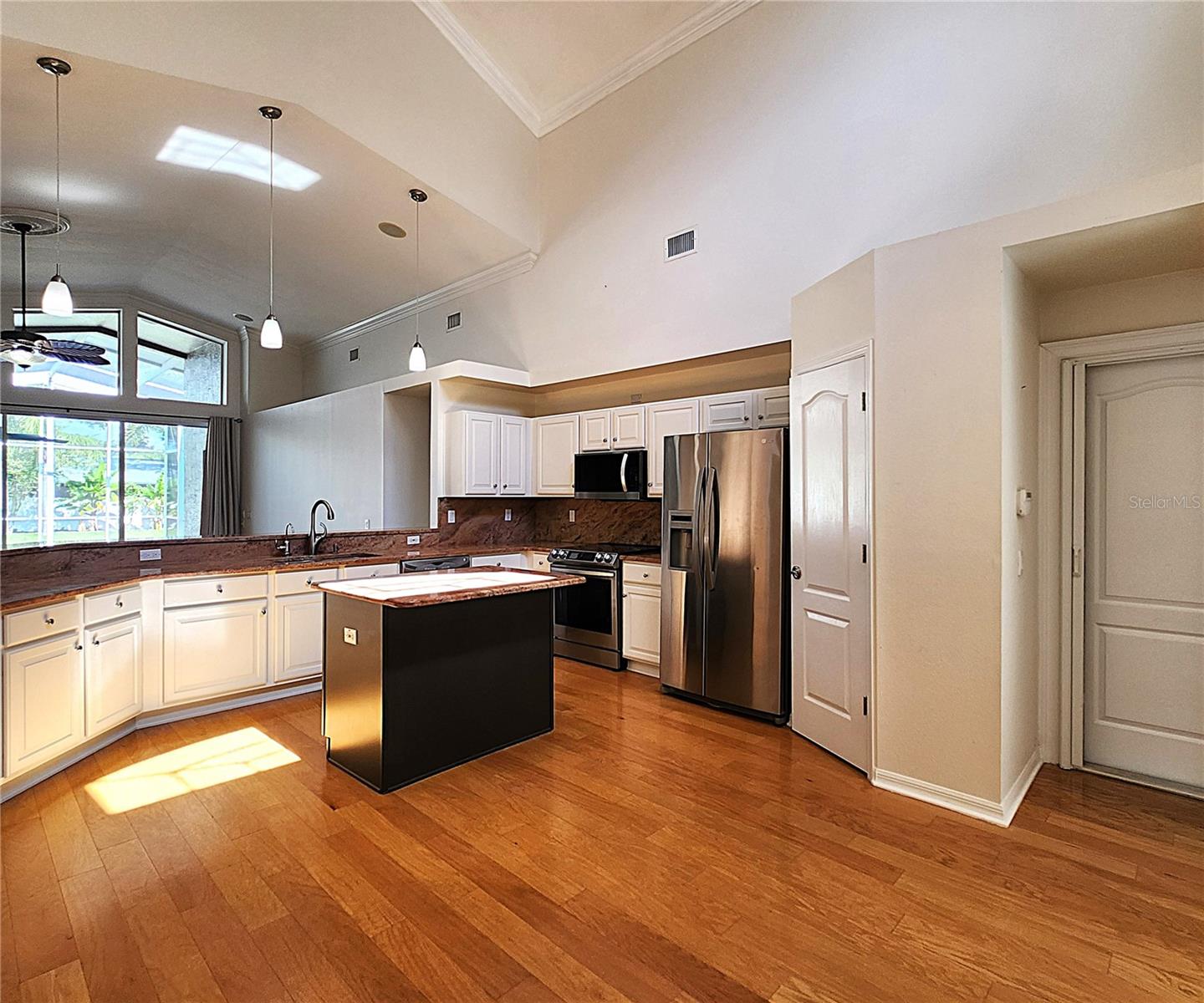 All appliances included: electric garbage disposal, dishwasher, mounted microwave, fridge, convection oven