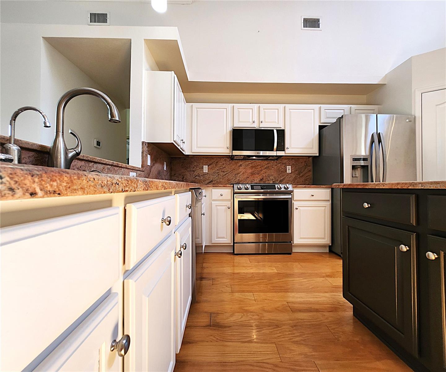 All appliances included: electric garbage disposal, dishwasher, mounted microwave, fridge, convection oven