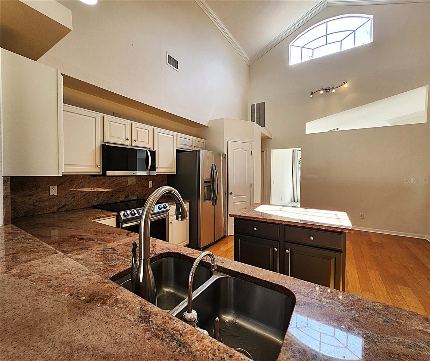 All appliances included: electric garbage disposal, dishwasher, mounted microwave, fridge, convection oven
