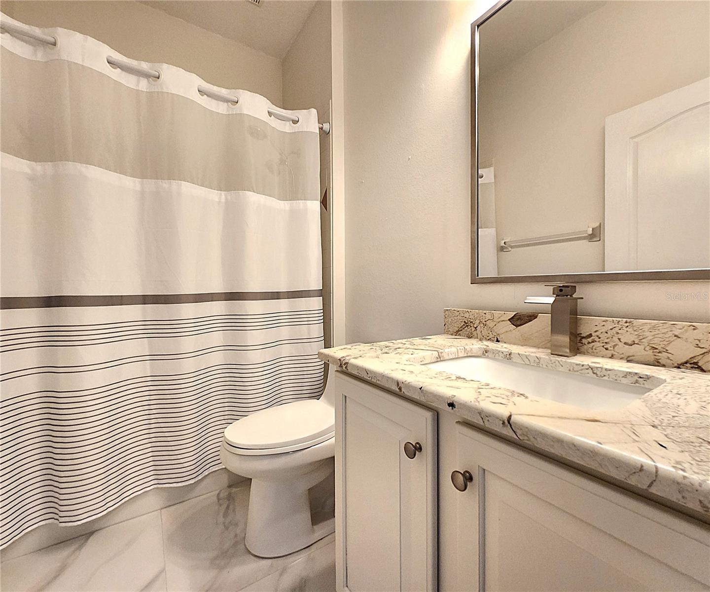 Guest Bathroom #2: Bathtub, Tiled Shower, Granite Countertop, Medicine Cabinet