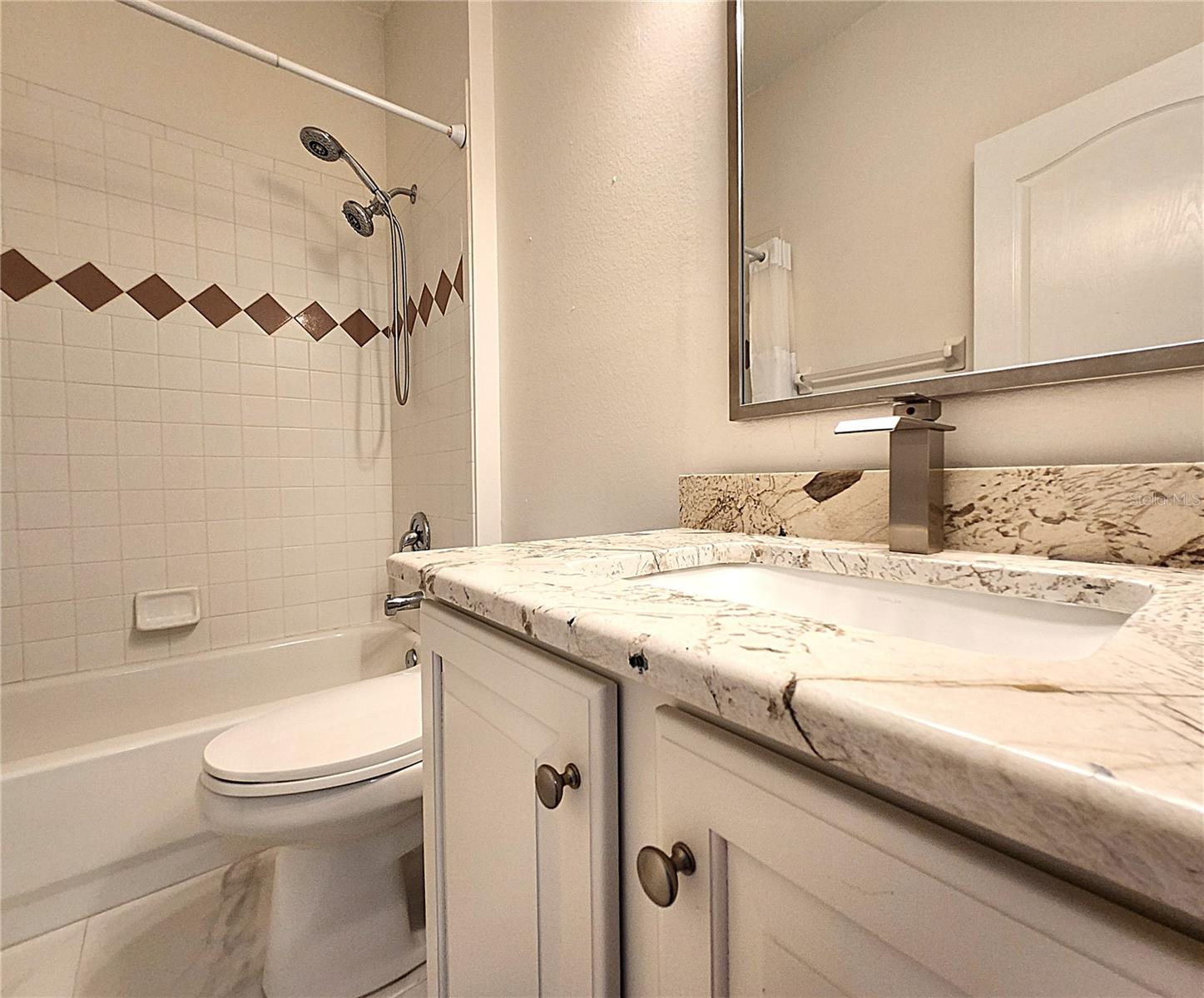 Guest Bathroom #2: Bathtub, Tiled Shower, Granite Countertop, Medicine Cabinet