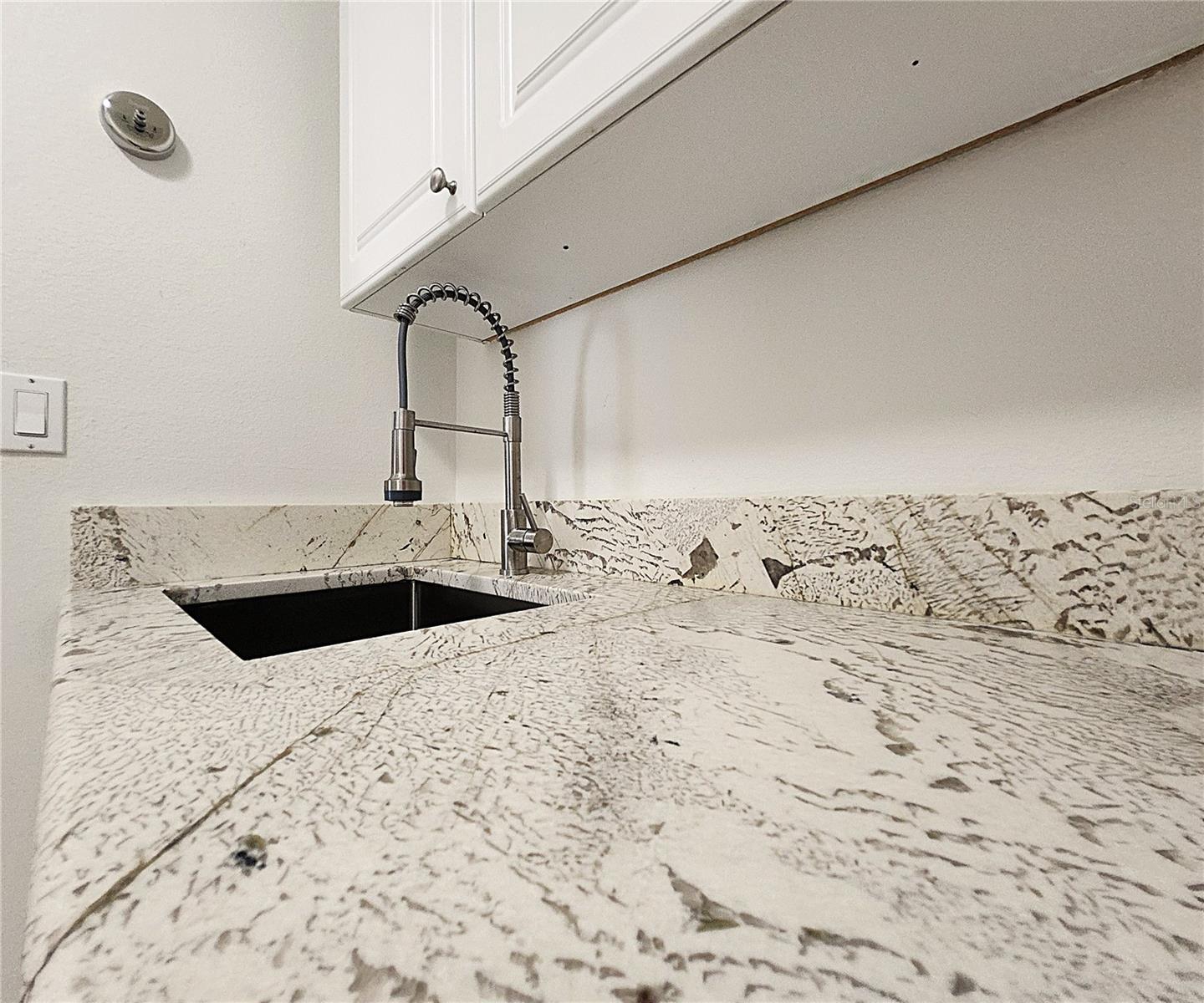 Inside Laundry Room: Cabinets, Granite Sink, Countertop, Washer & Dryer Hook-Ups