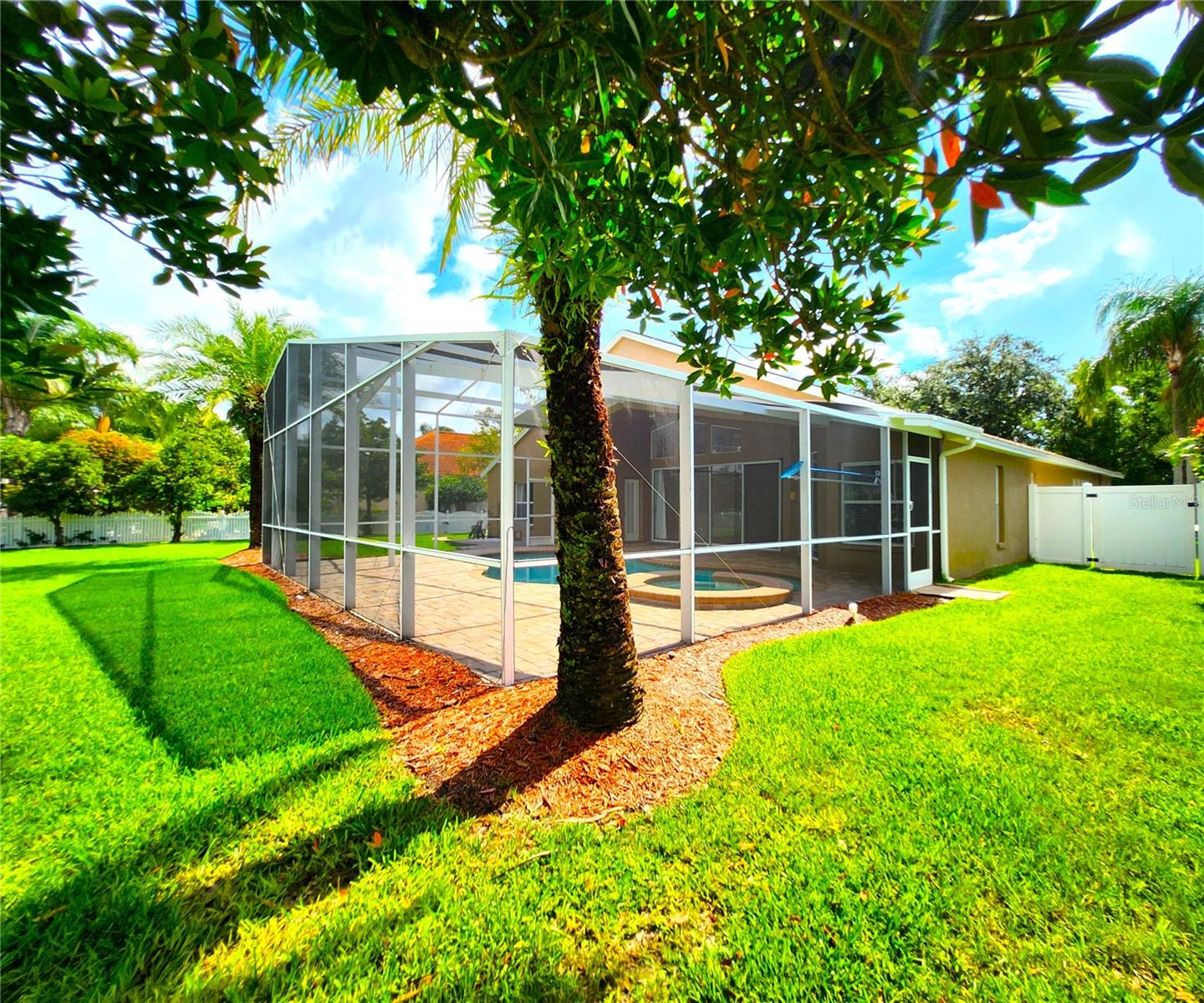 St. Augustine grass, irrigation front & back, fenced in, new mulch, manicured lawn