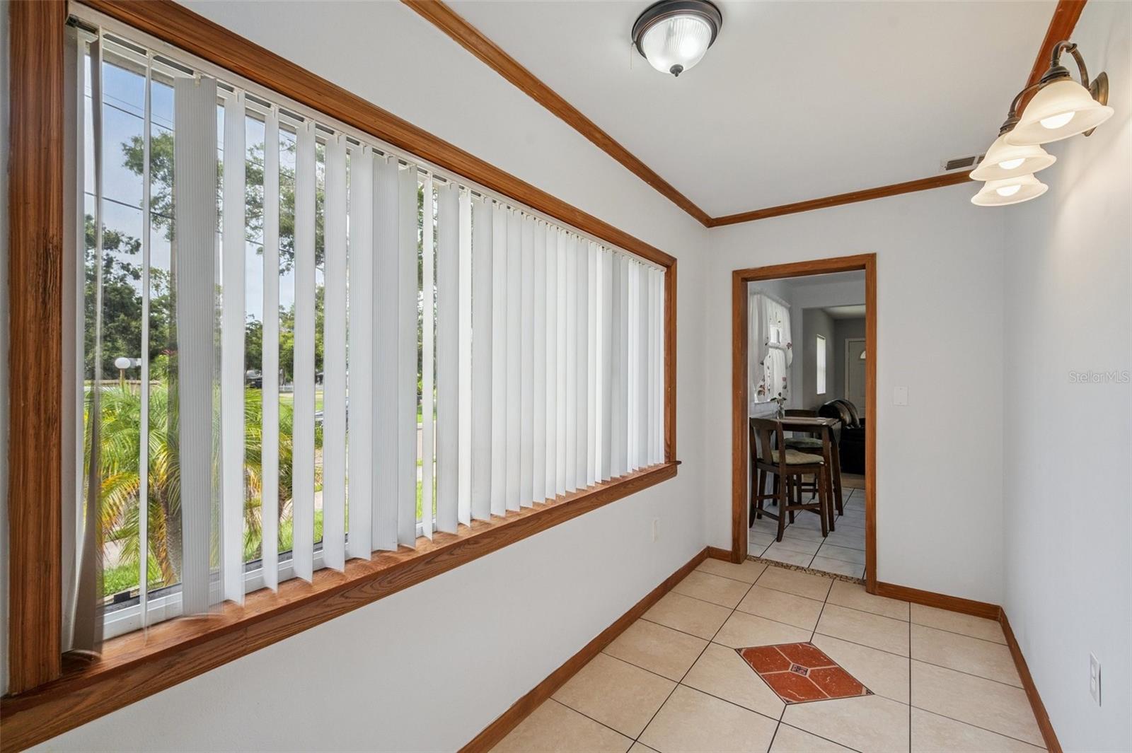 Back hallway from kitchen to rear entry that leads to the back yard with covered carport