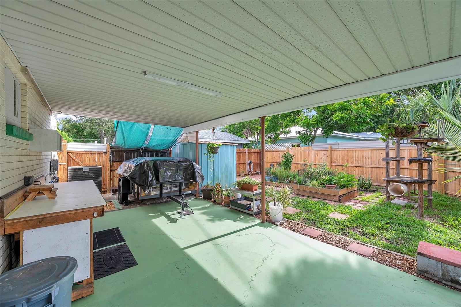 Amazing fully fenced back yard with covered carport