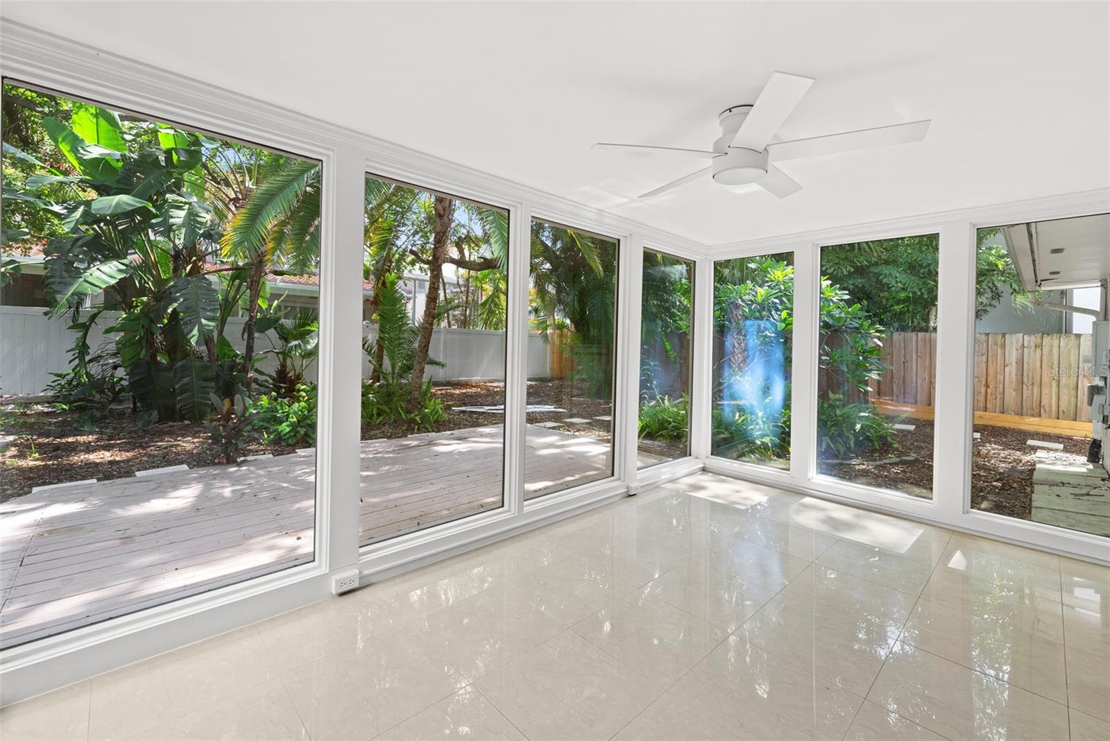 view of back yard from sun room