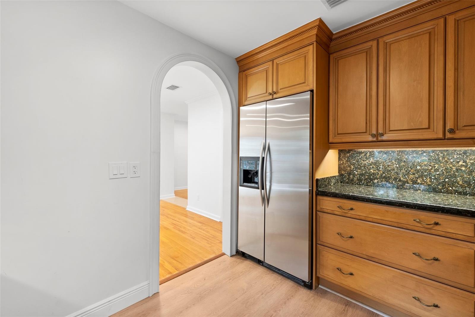 pretty arched door to kitchen