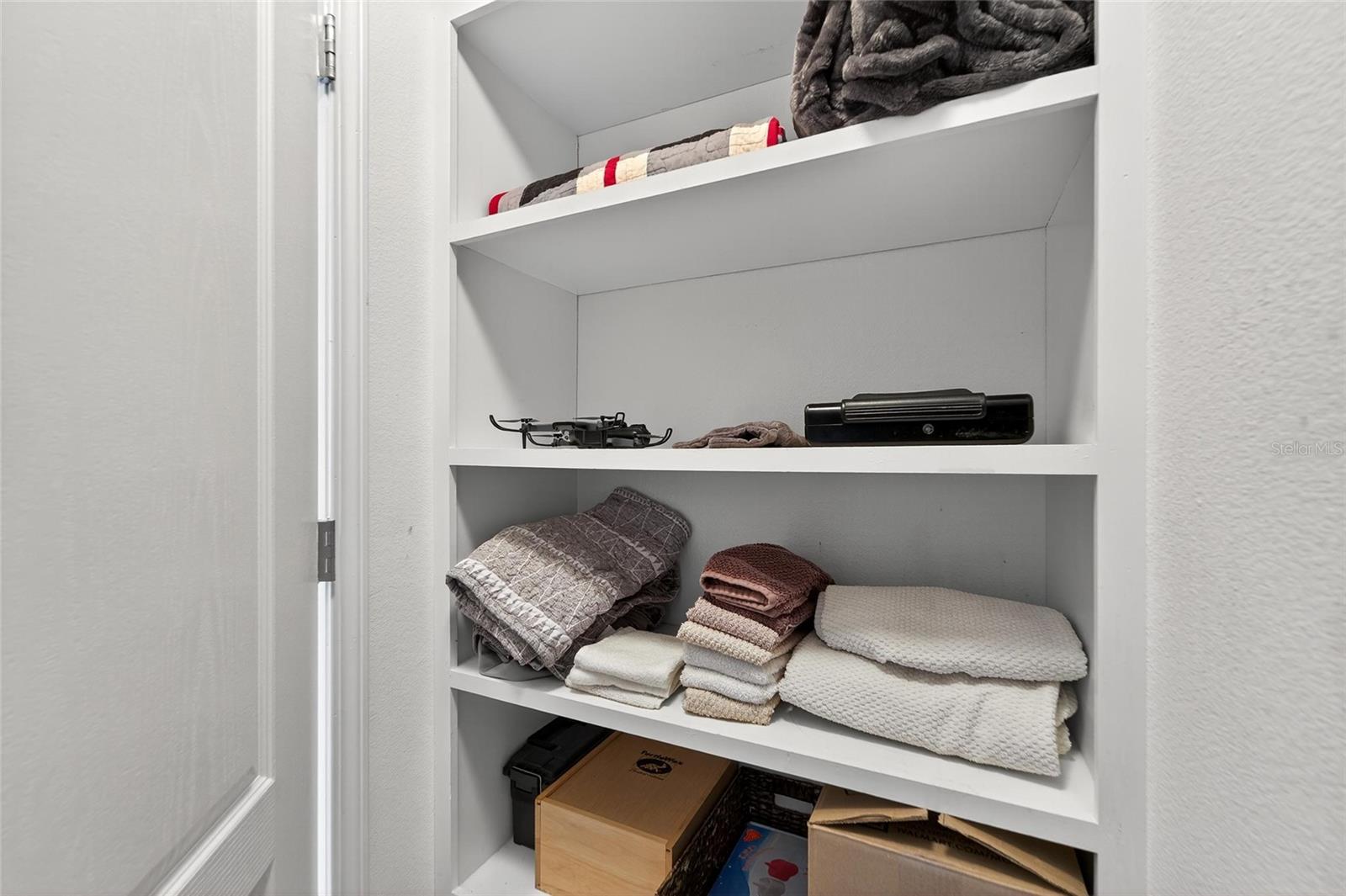 Custom built in shelves in the master closet!