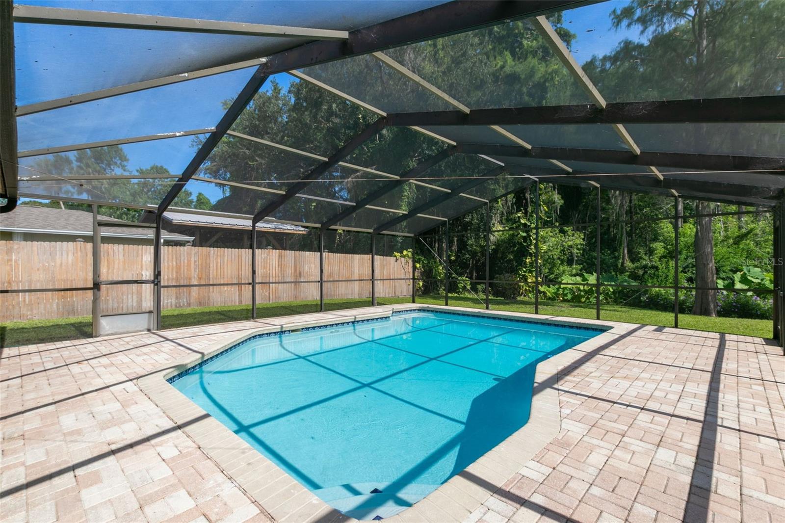 View of oversized pool and Preserve