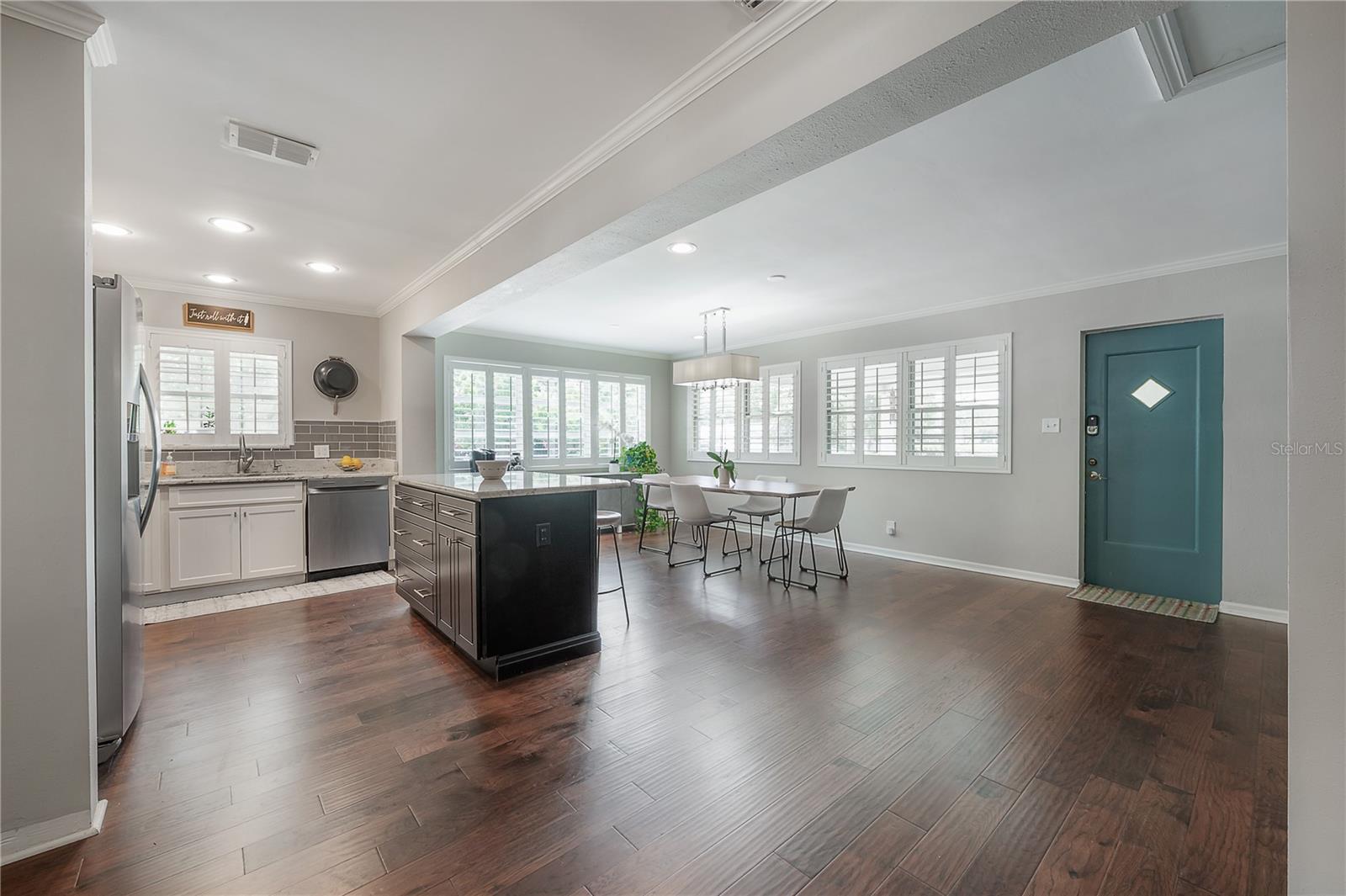 Open Concept Dining and Kitchen Area, Door to Carport