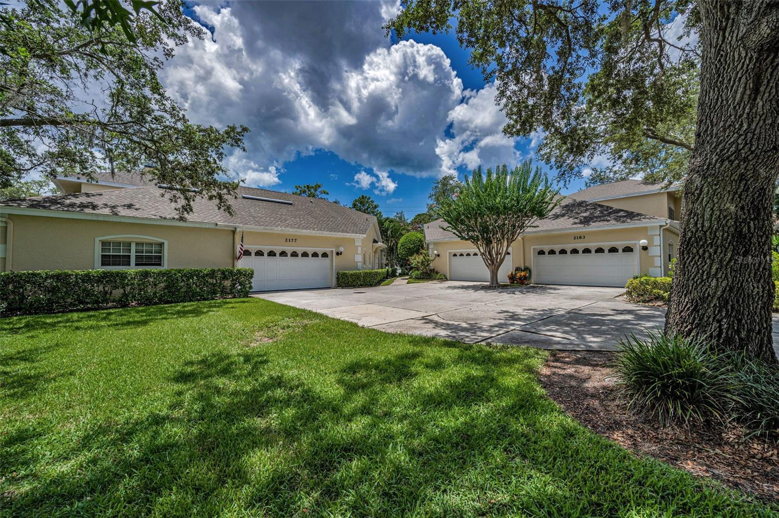 Front Exterior View with Parking Area in Front of 2-Car Garage