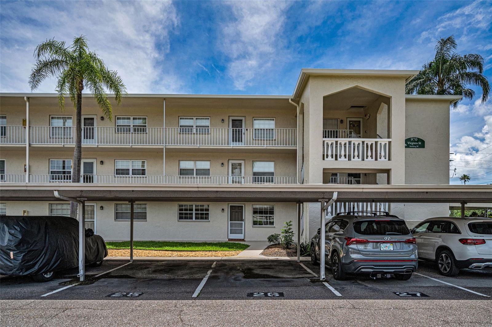 Covered Parking spot #25, right in front of your ground floor condo