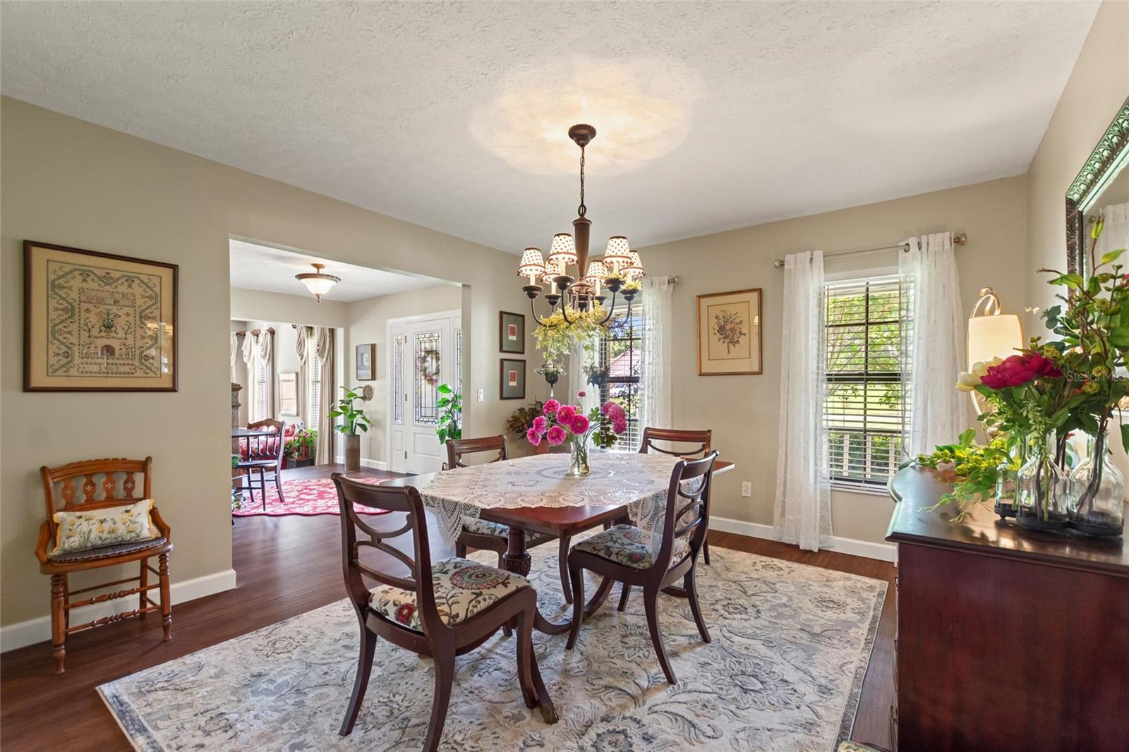 Formal dining room looking back to foyer and front door.  The kitchen has ample seating so if you do not need a formal dining area, this room would make a great den or library.