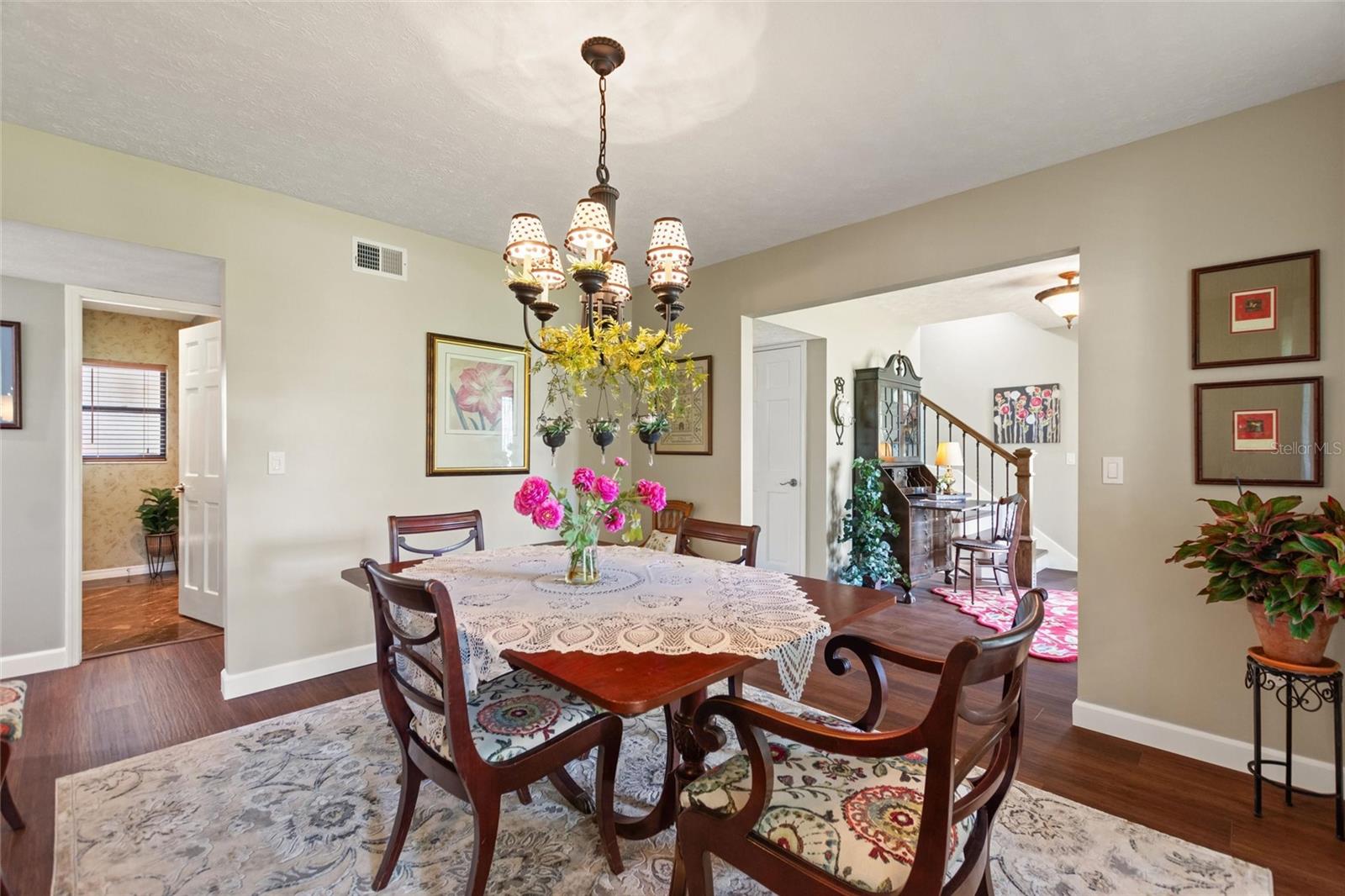 Dining room with look into foyer.  The room in the back left of the picture is the downstairs powder room.