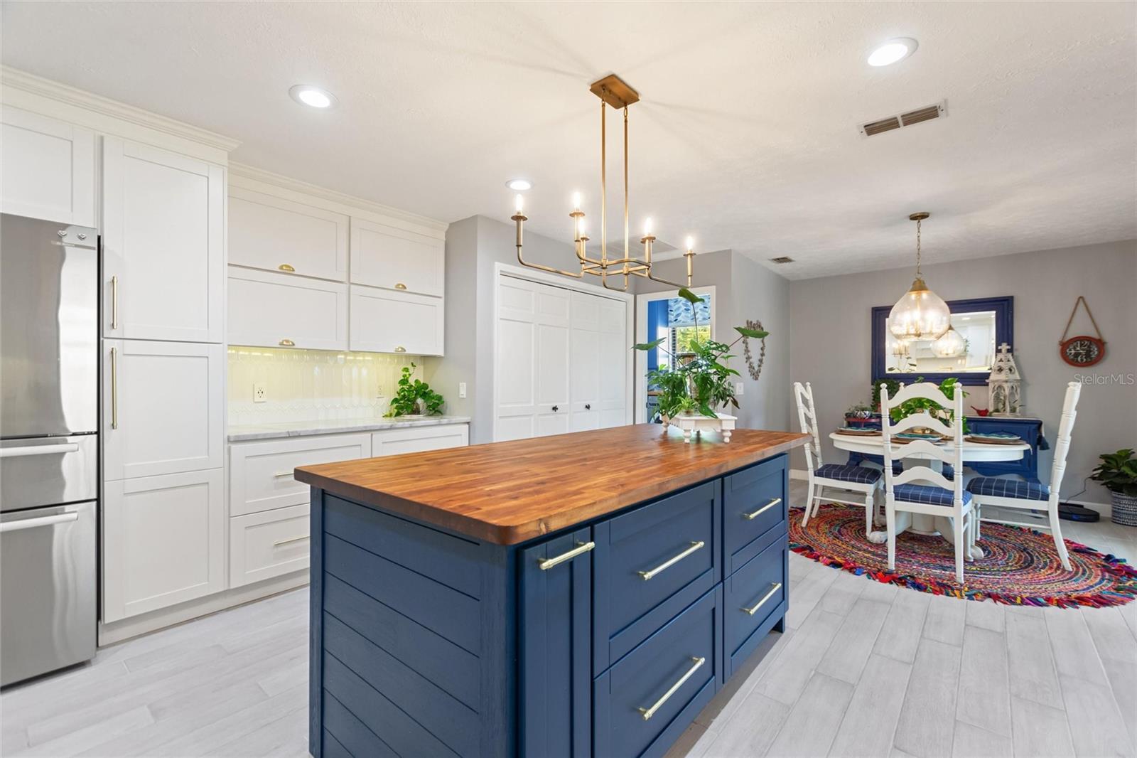 This view shows the other side of the island and also the breakfast area.  Just look at all the cabinet and storage space!