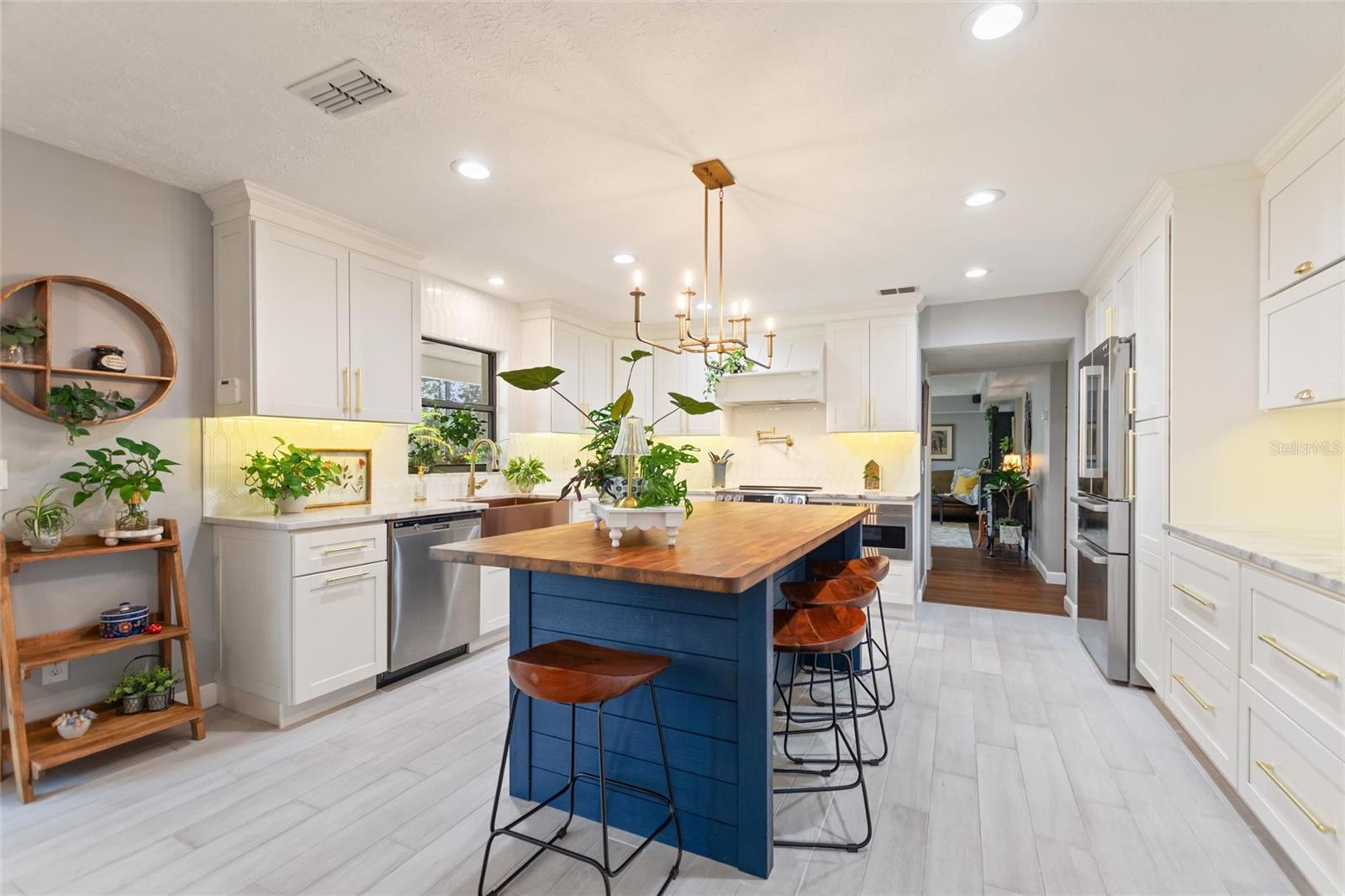 Dreamy kitchen with exotic marble counter tops, stainless steel appliances and soft-close cabinetry.