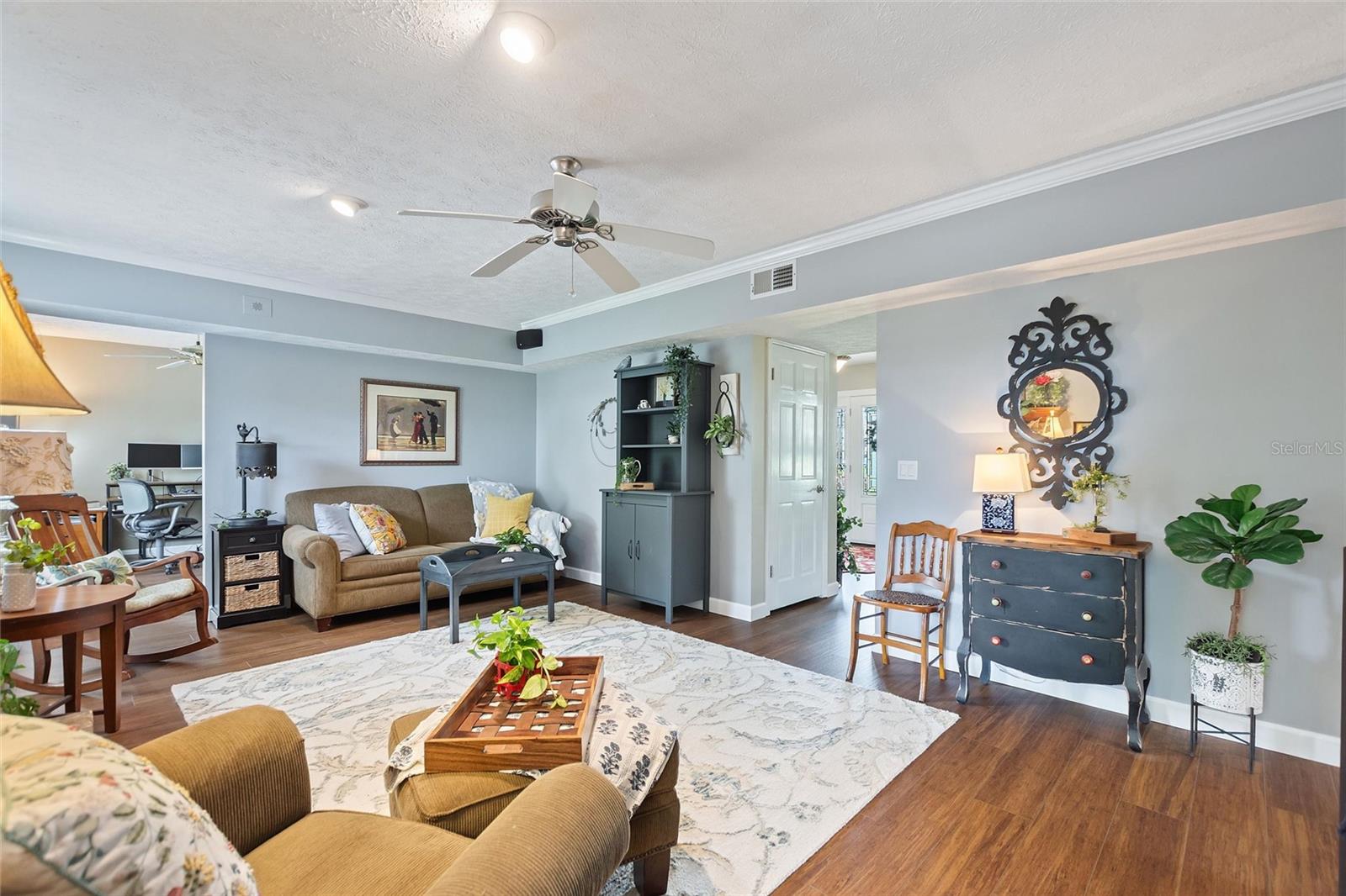 Family room with a view into the home office and foyer.