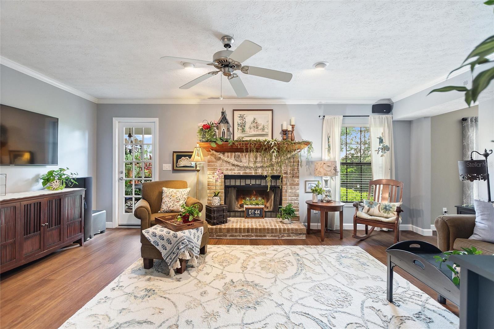 Family room with wood burning fireplace.