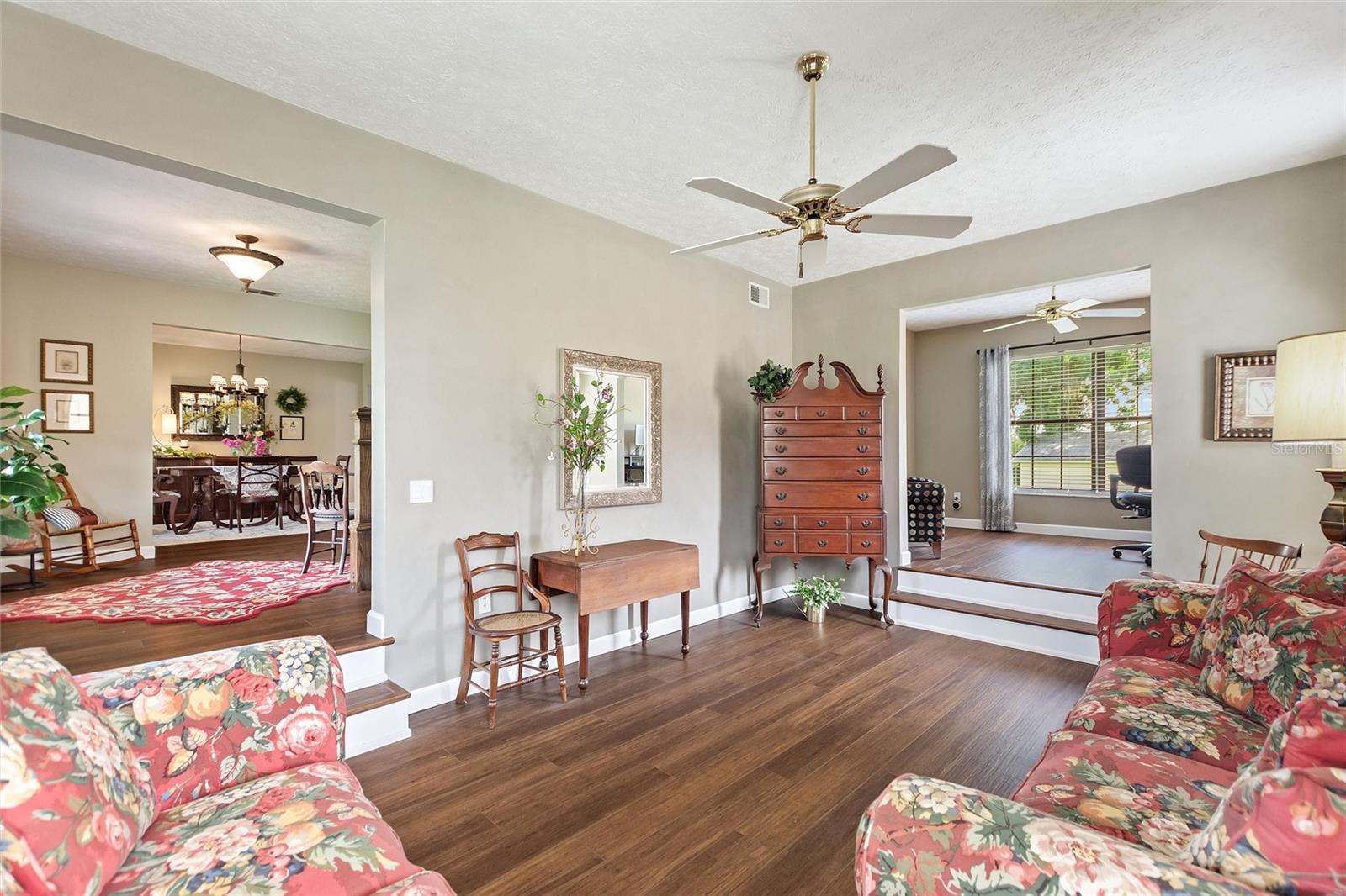 View from the living/sitting room in relation to the office, foyer and formal dining room.