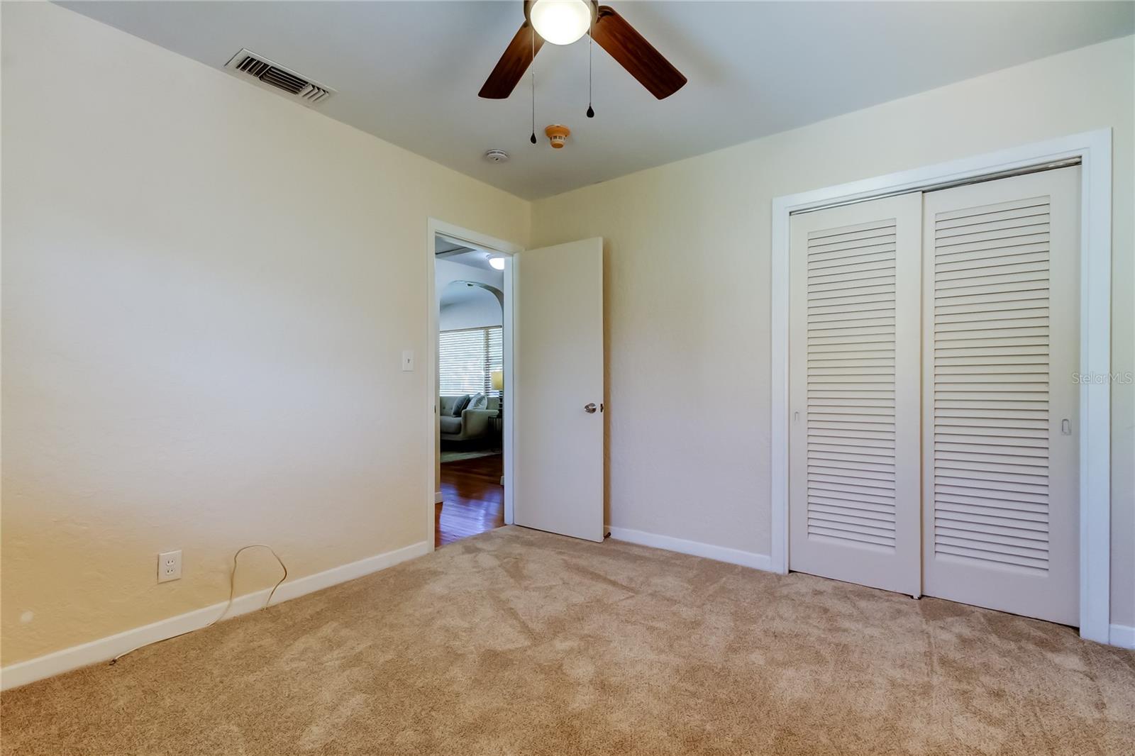 Second bedroom looking towards hallway and living room.