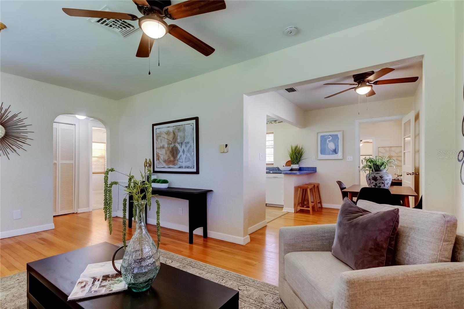 Living room looking towards hallway, 2nd bedroom, dining room, breakfast bar and pass through.