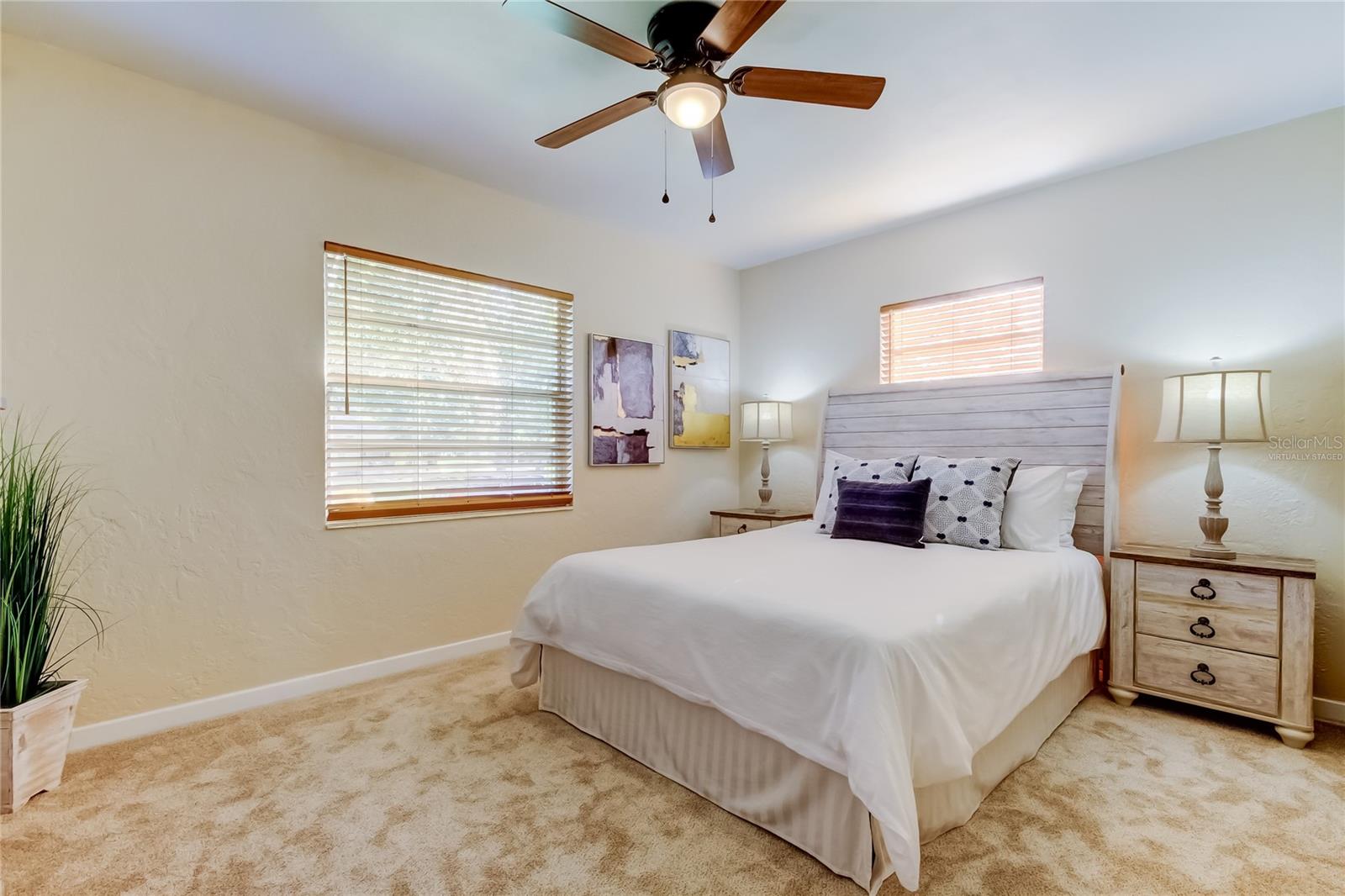 Primary bedroom with new carpet and blinds.
