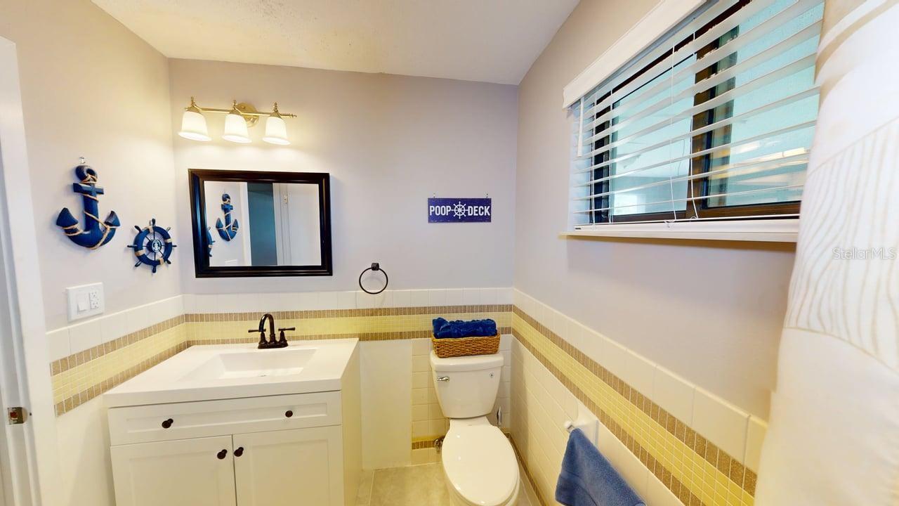 Main bathroom featuring a tub