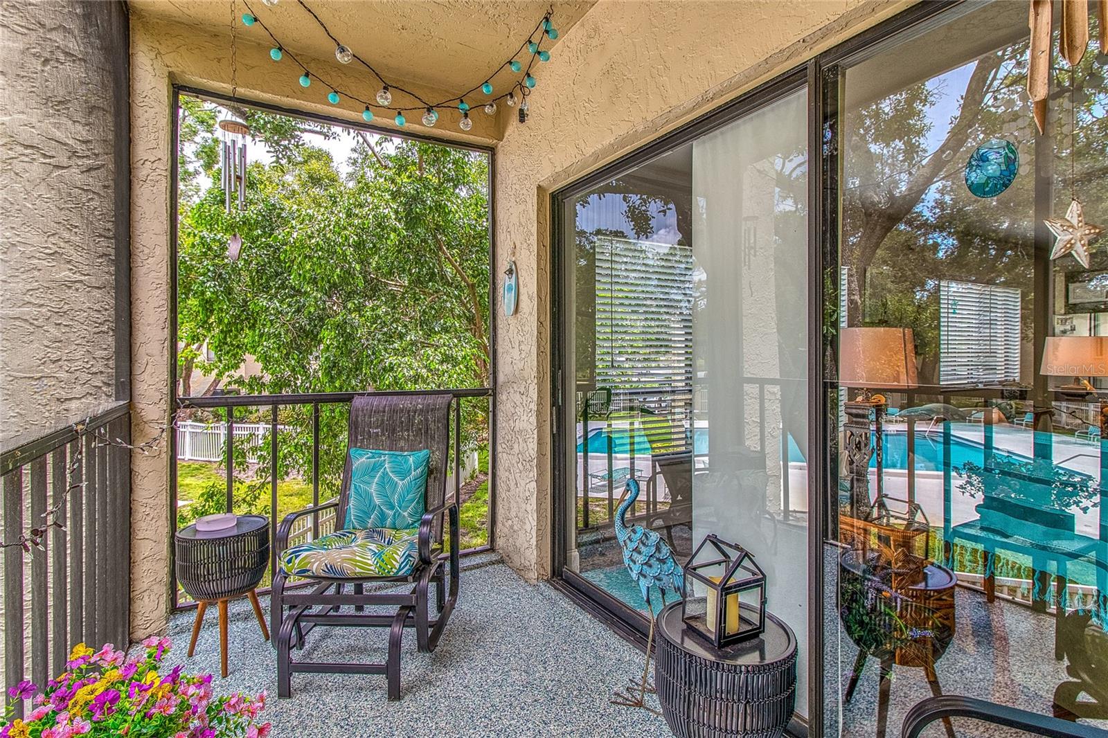 A beautiful epoxy floor makes this porch so charming!