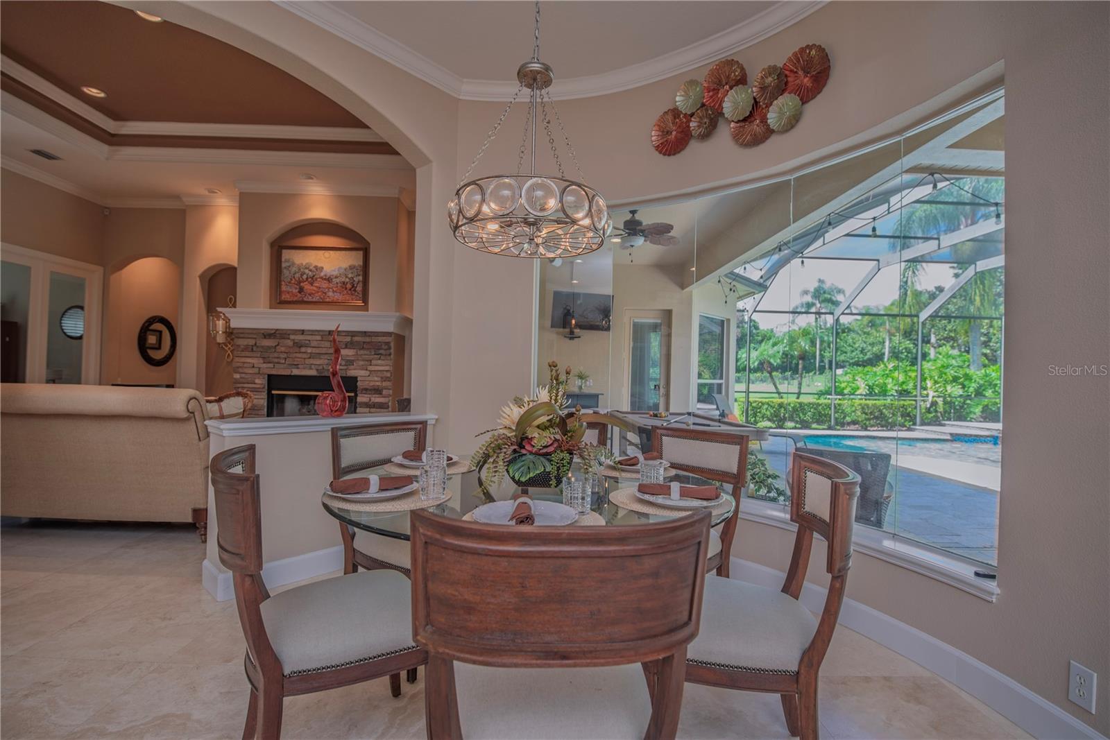 Dinette next to beveled glass windows overlooking the lanai.