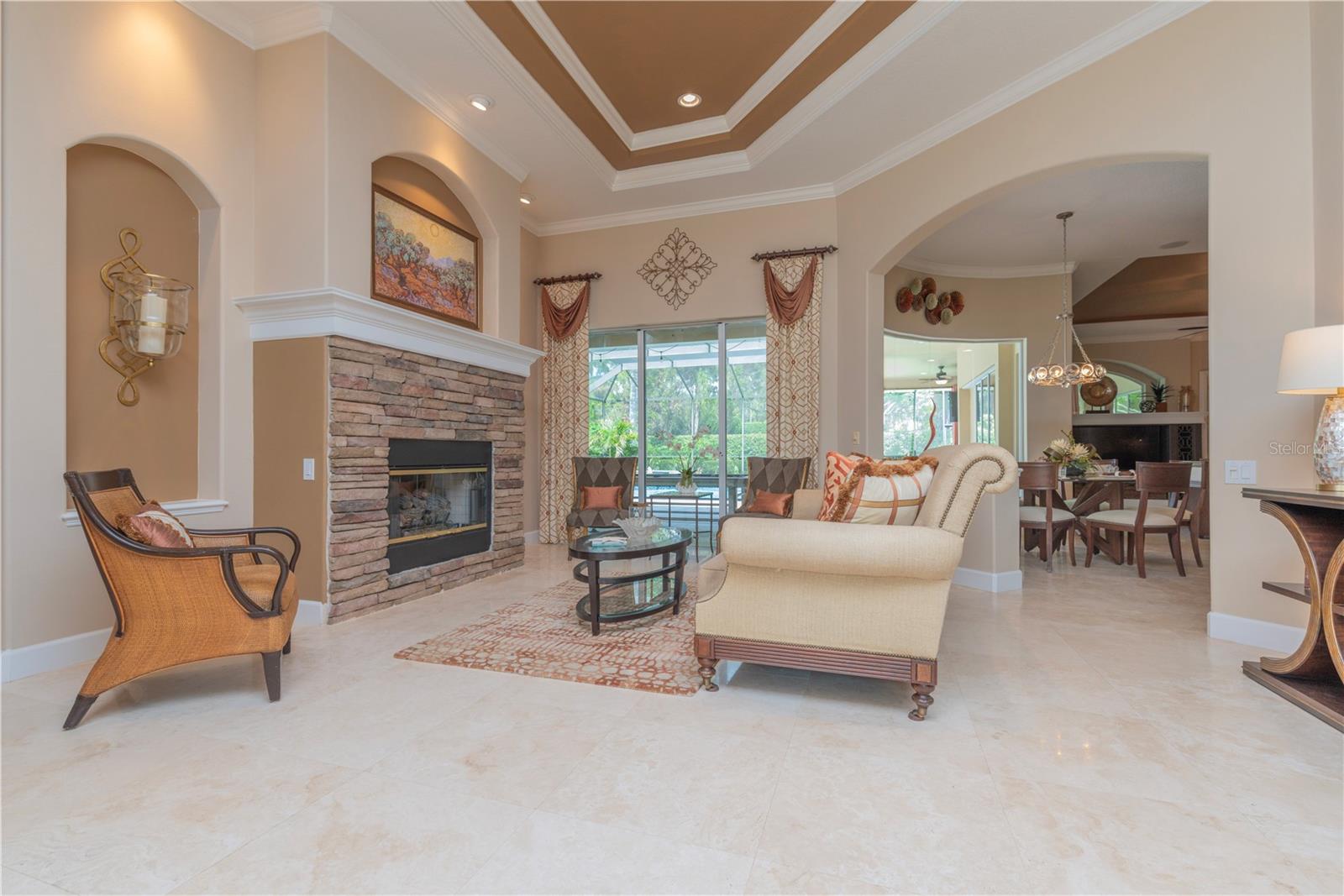Formal living room with gas fireplace.